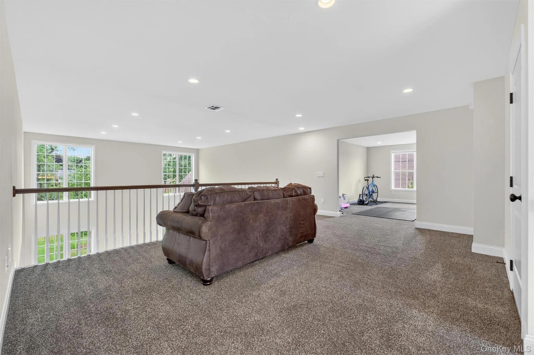 Spacious upper-level loft/flexarea featuring plush carpet flooring, recessed lighting Spacious upper-level loft/flexarea featuring plush carpet flooring, recessed lighting