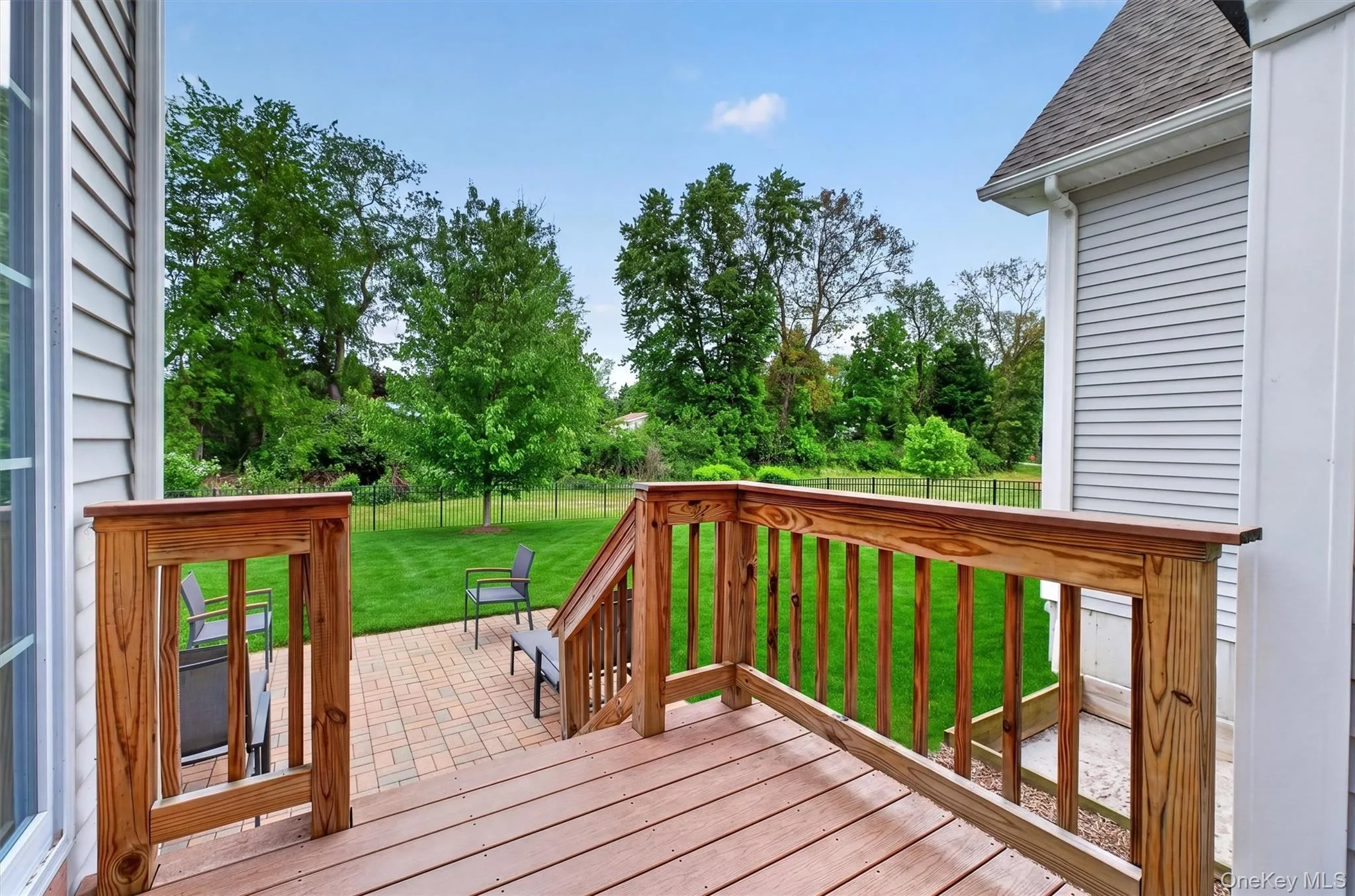 Composite deck with natural wood railings Composite deck with natural wood railings