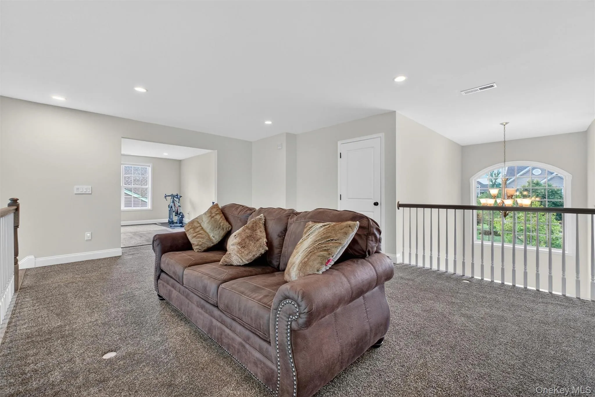 Spacious upper-level loft/flexarea featuring plush carpet flooring, recessed lighting Spacious upper-level loft/flexarea featuring plush carpet flooring, recessed lighting
