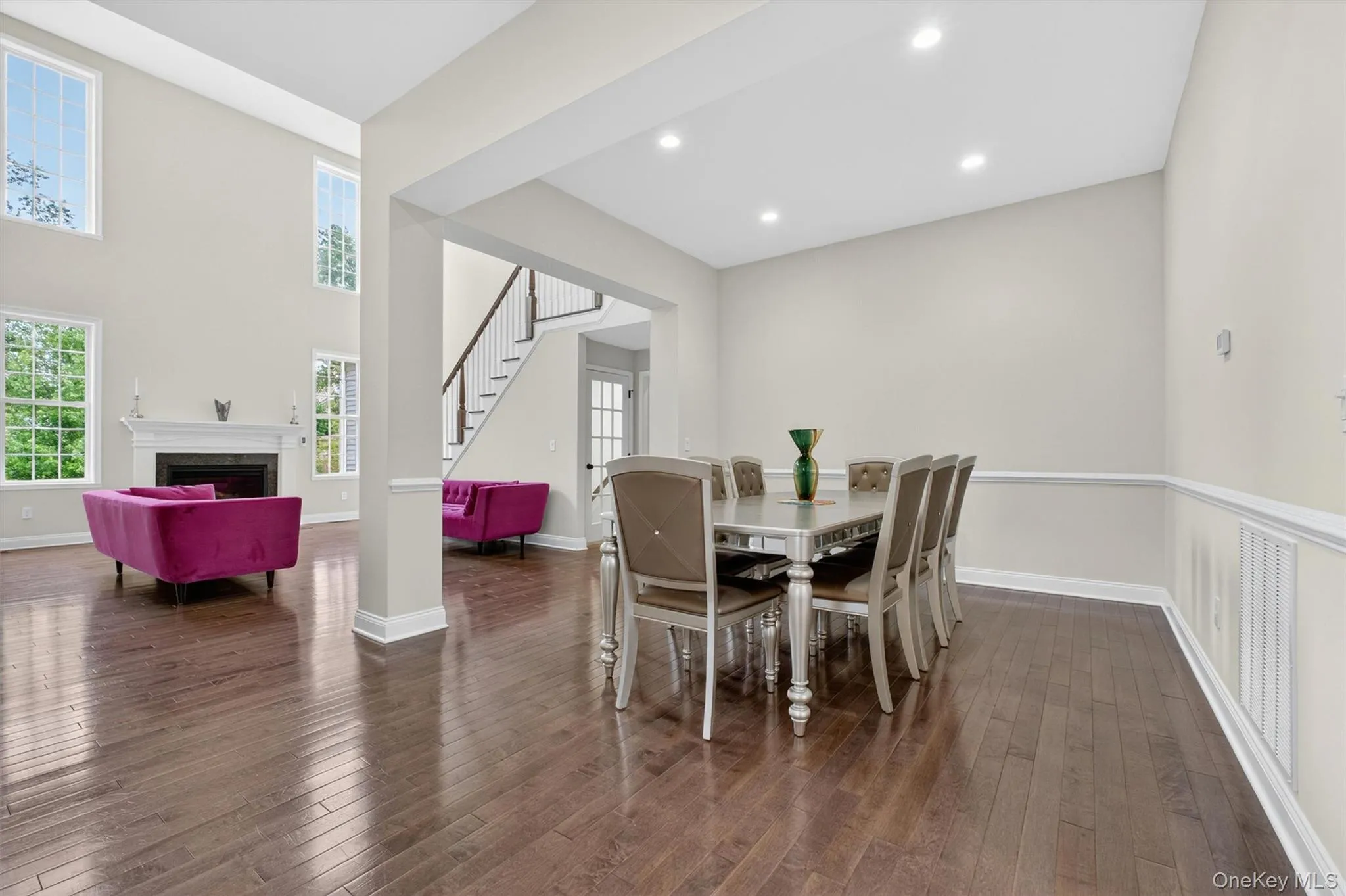 Open-concept living space featuring wood-finish flooring throughout Open-concept living space featuring wood-finish flooring throughout