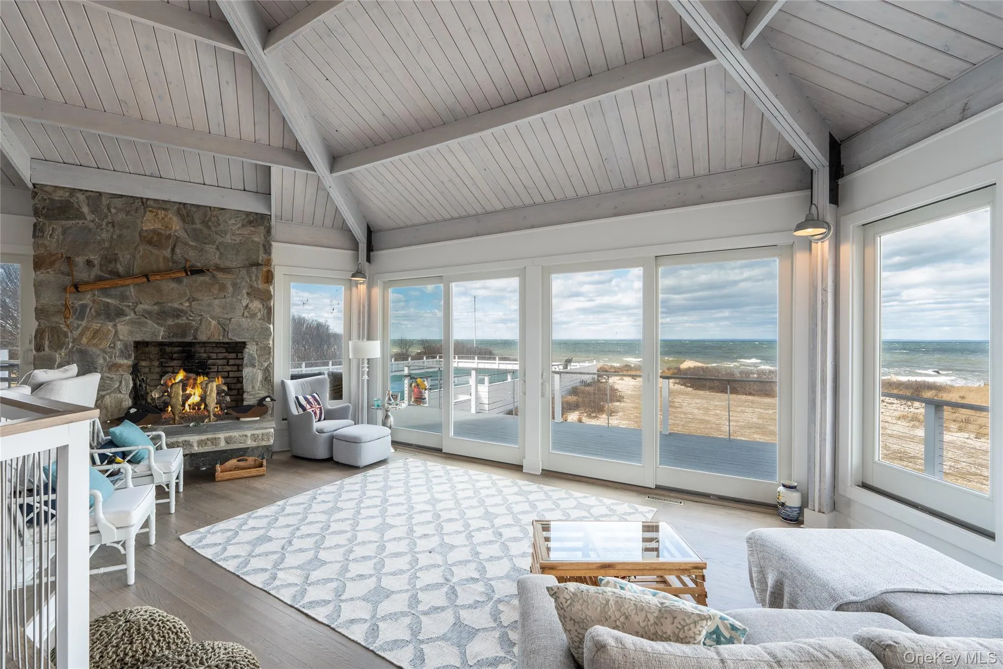 Sunroom / solarium featuring beamed ceiling Sunroom / solarium featuring beamed ceiling
