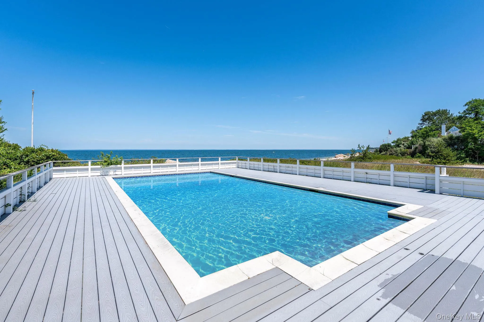 View of swimming pool with a deck with water view View of swimming pool with a deck with water view