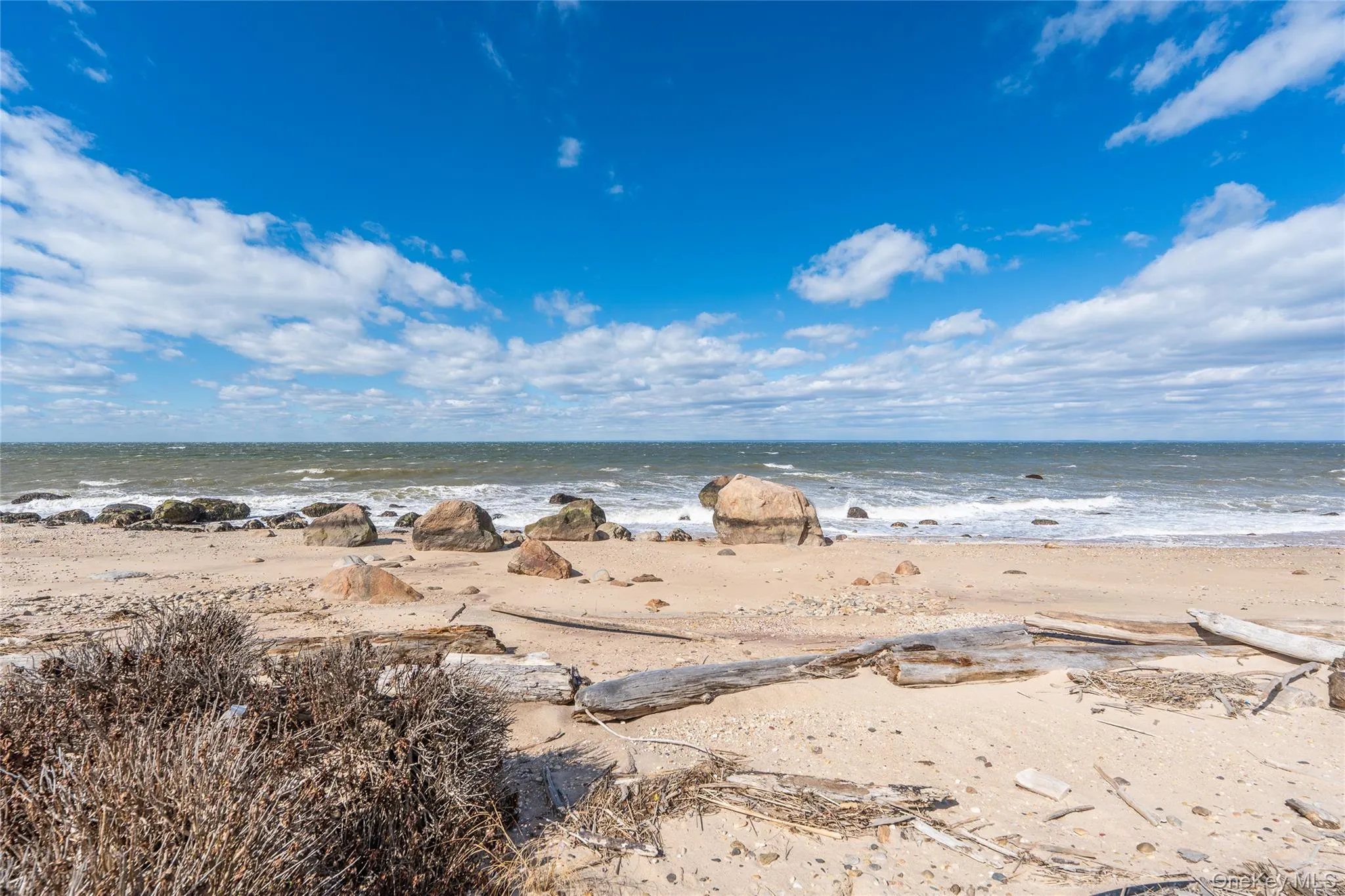 Property view of water with a beach view Property view of water with a beach view