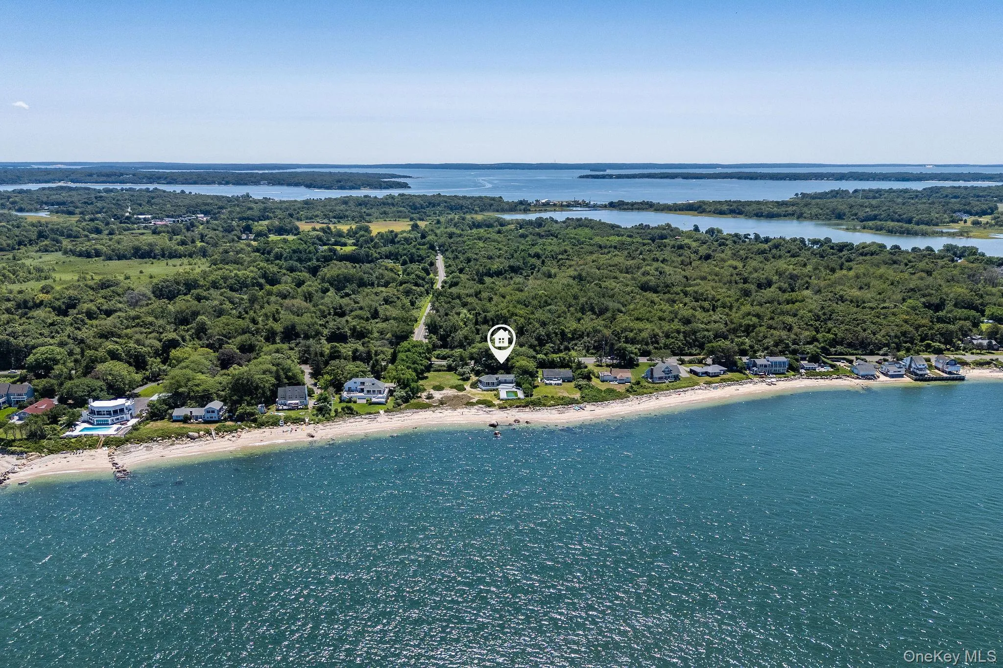 Bird's eye view of unending shoreline and a heavily wooded area Bird's eye view of unending shoreline and a heavily wooded area