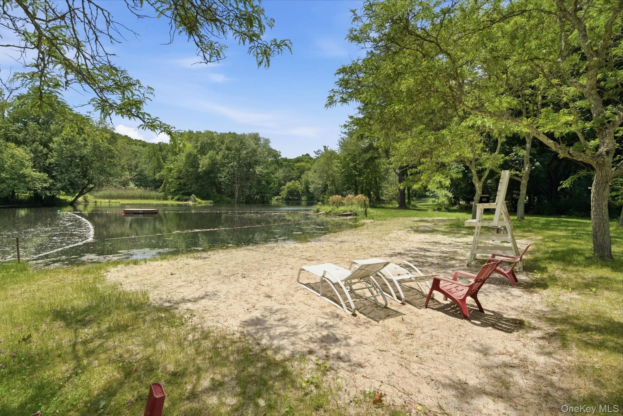Members of the Deans Pond Association enjoy a real sandy swim beach with a lifeguard, a roped-off swim area, and a floating dock. Members of the Deans Pond Association enjoy a real sandy swim beach with a lifeguard, a roped-off swim area, and a floating dock.