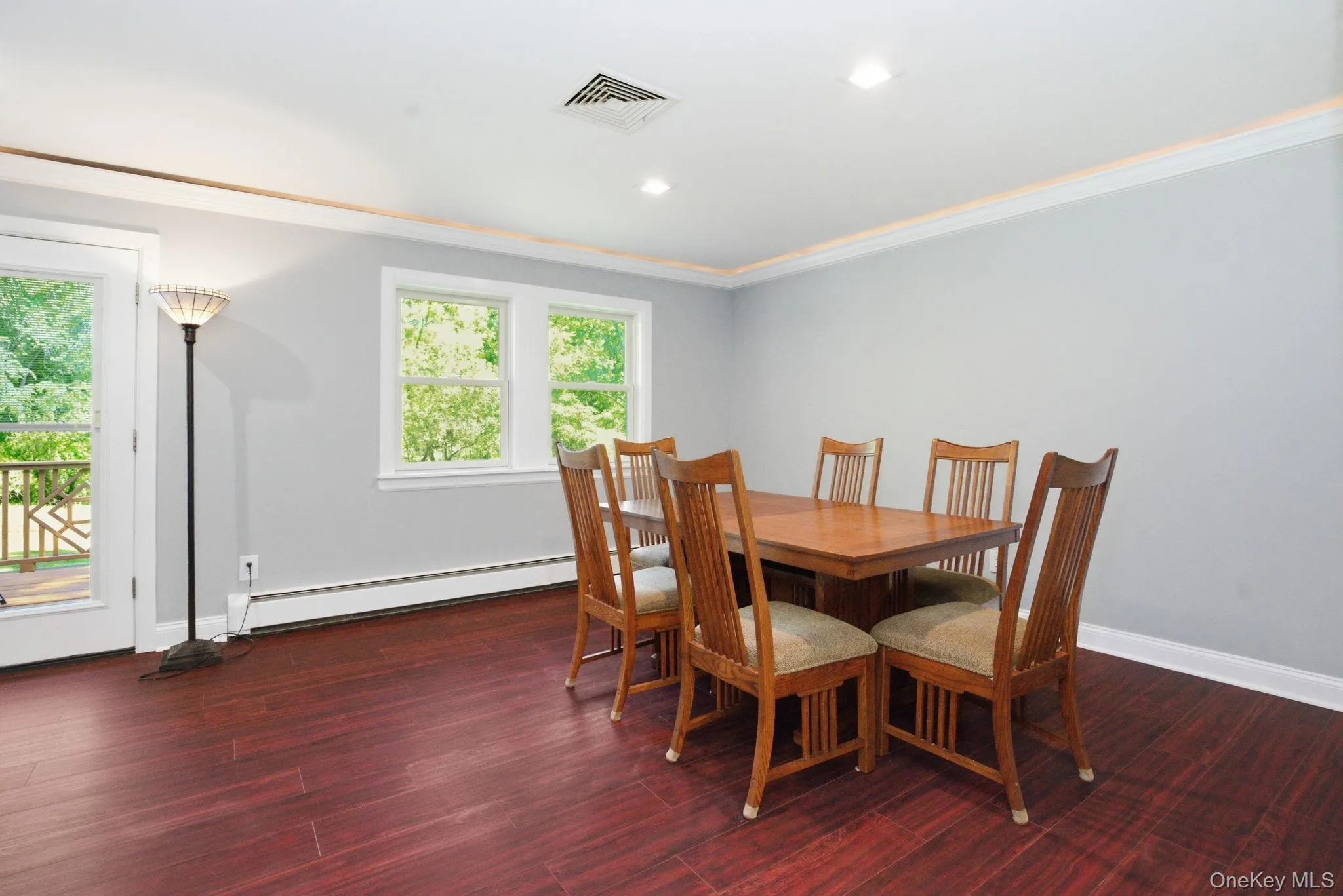 Step-out access to the deck makes this dining space as easy for morning coffee as it is for hosting. Step-out access to the deck makes this dining space as easy for morning coffee as it is for hosting.