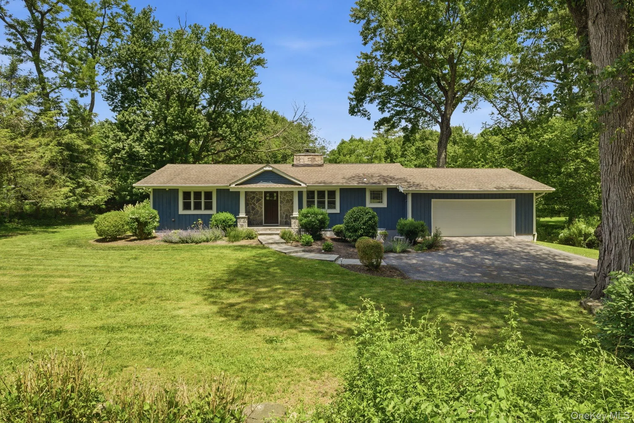 Set back from the road on a lush 1.2-acre corner, this renovated ranch offers privacy, space, and a coveted Deans Pond address. Set back from the road on a lush 1.2-acre corner, this renovated ranch offers privacy, space, and a coveted Deans Pond address.