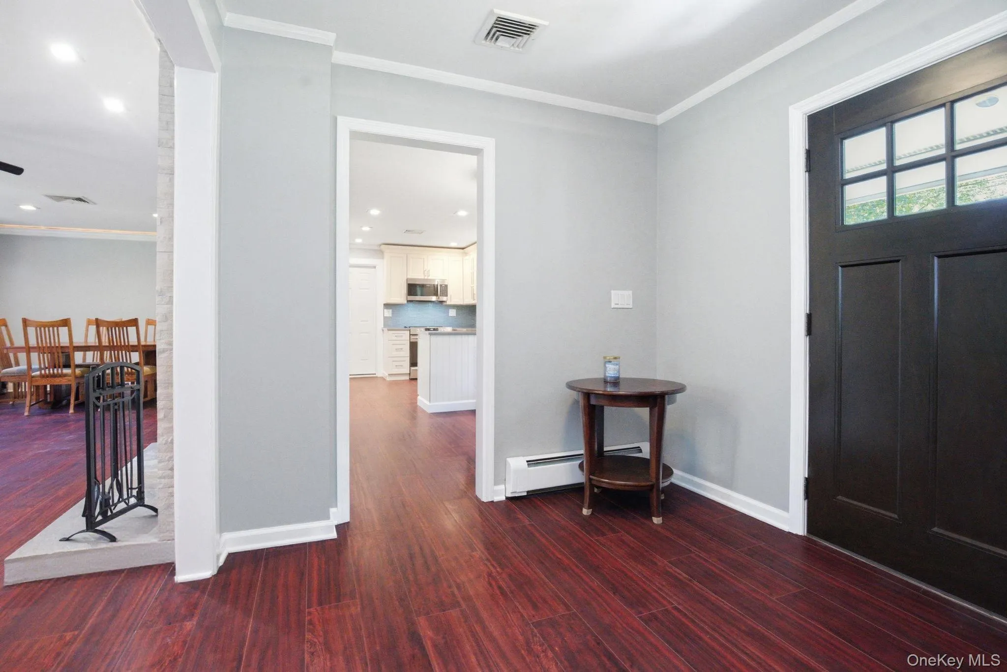 An open foyer flows effortlessly to the kitchen, dining, and living spaces, single-level living at its easiest. An open foyer flows effortlessly to the kitchen, dining, and living spaces, single-level living at its easiest.