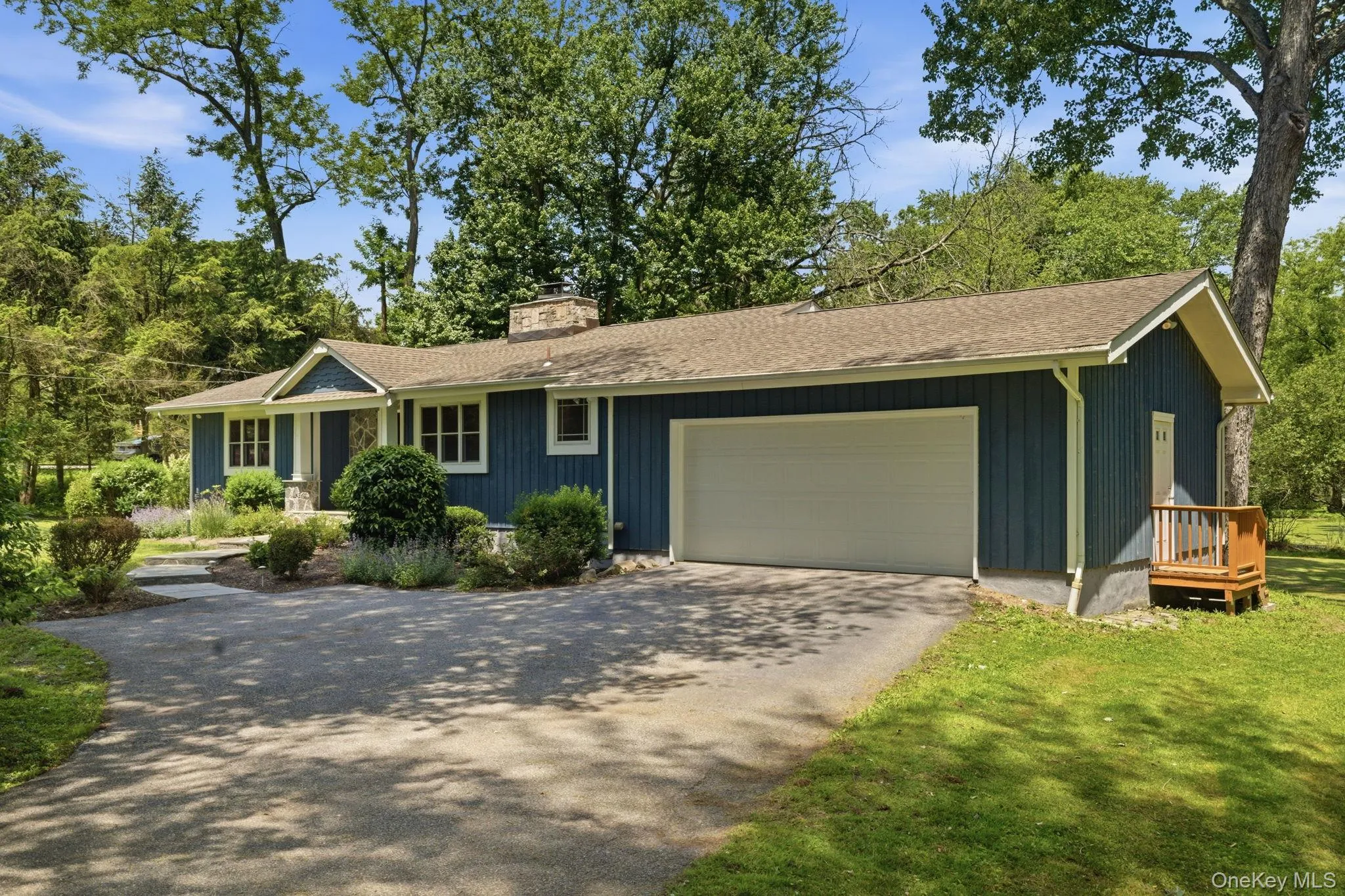 The attached two-car garage and level, beautifully kept grounds make everyday life effortless. The attached two-car garage and level, beautifully kept grounds make everyday life effortless.