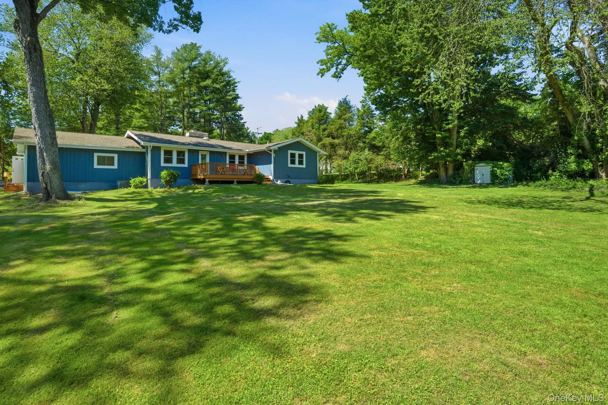 The yard opens up wide and flat, with a tucked-in storage shed and plenty of green for a garden, a game of catch, or whatever summer calls for. The yard opens up wide and flat, with a tucked-in storage shed and plenty of green for a garden, a game of catch, or whatever summer calls for.