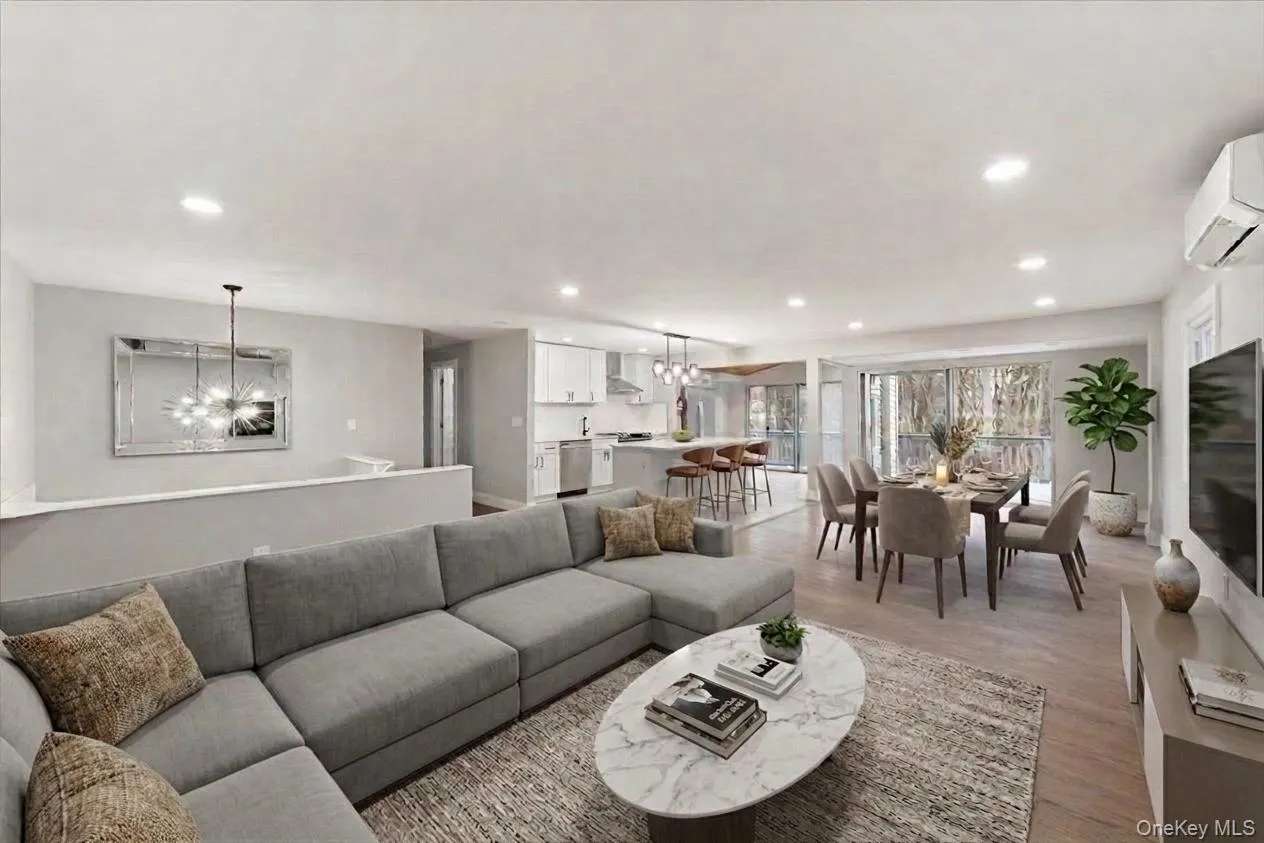 Staged Open-concept living/dining space on the main floor. Staged Open-concept living/dining space on the main floor.