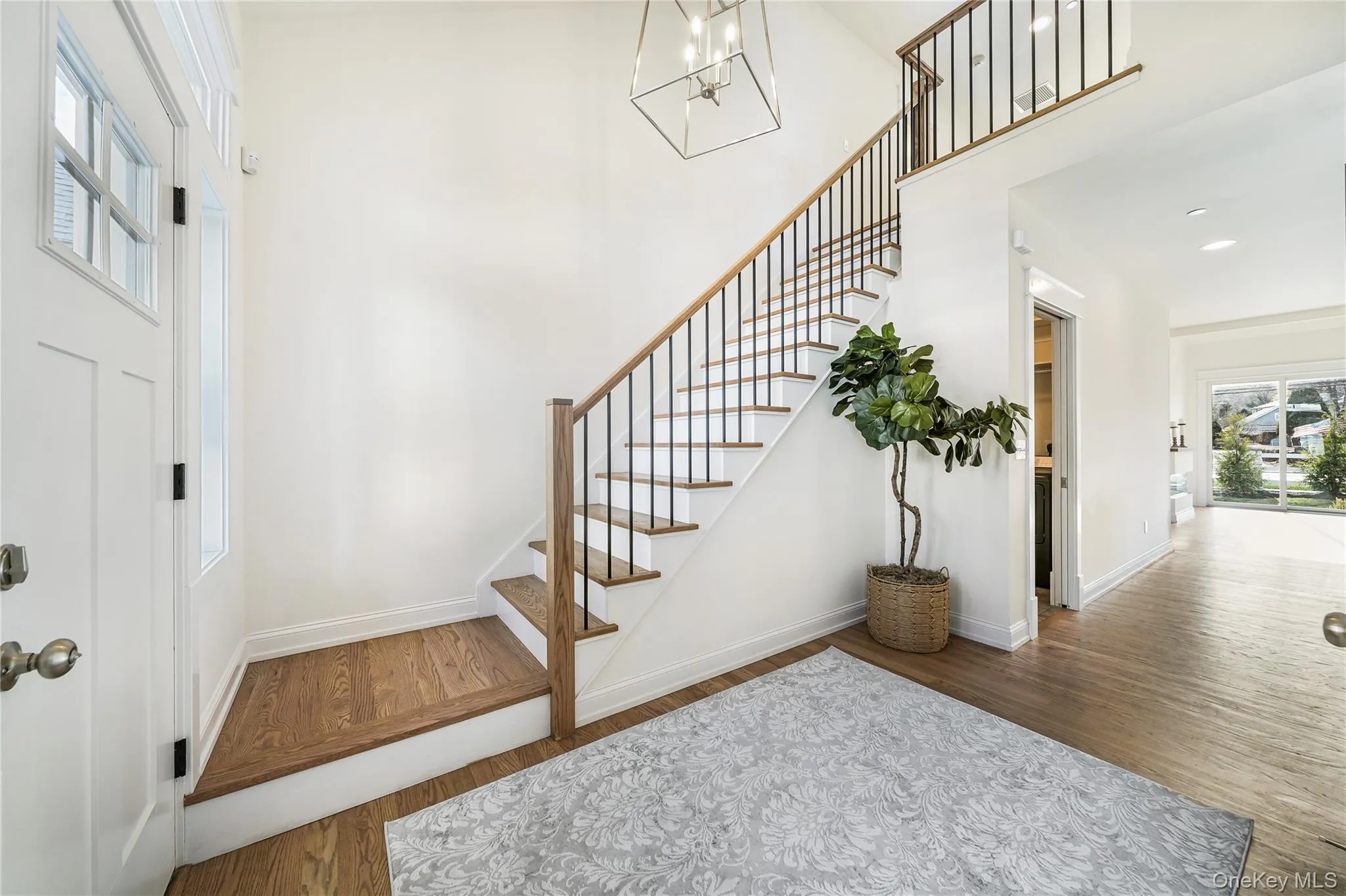 Entryway featuring hardwood / wood-style floors Entryway featuring hardwood / wood-style floors