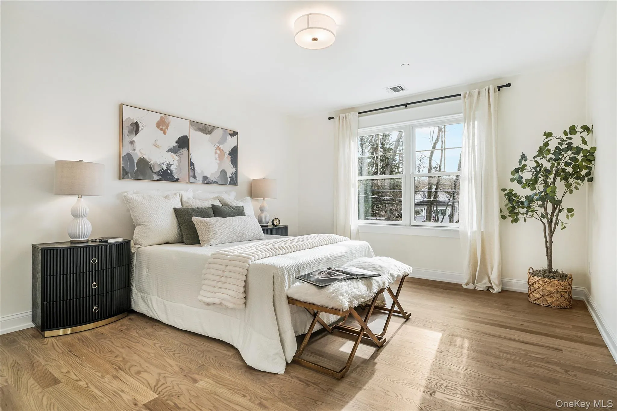 Bedroom with hardwood / wood-style floors Bedroom with hardwood / wood-style floors