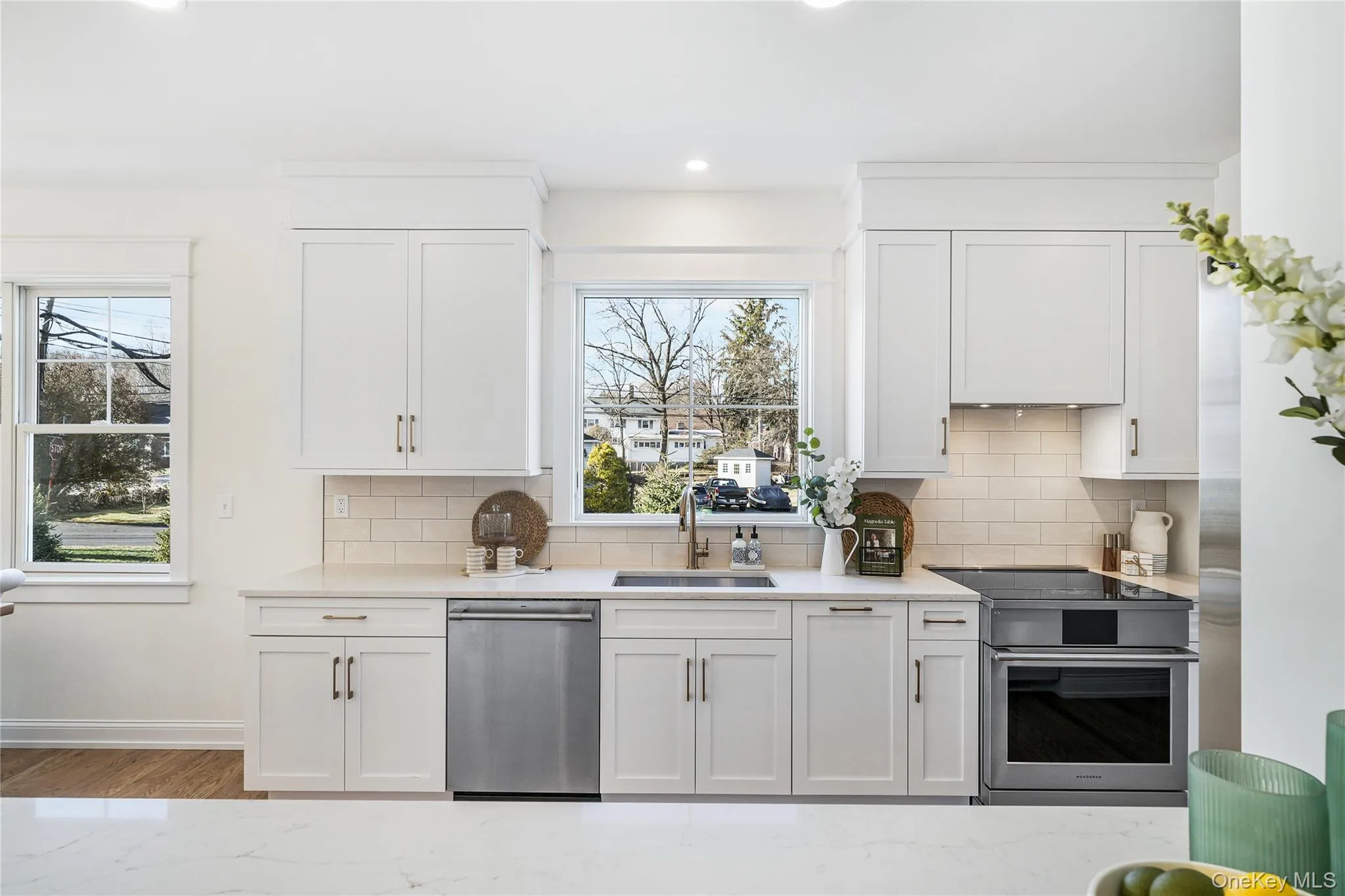 Kitchen featuring white cabinetry and sink Kitchen featuring white cabinetry and sink