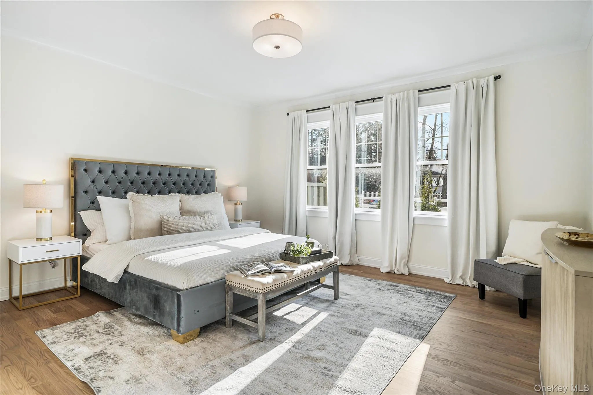 Bedroom with dark hardwood / wood-style flooring and ornamental molding Bedroom with dark hardwood / wood-style flooring and ornamental molding