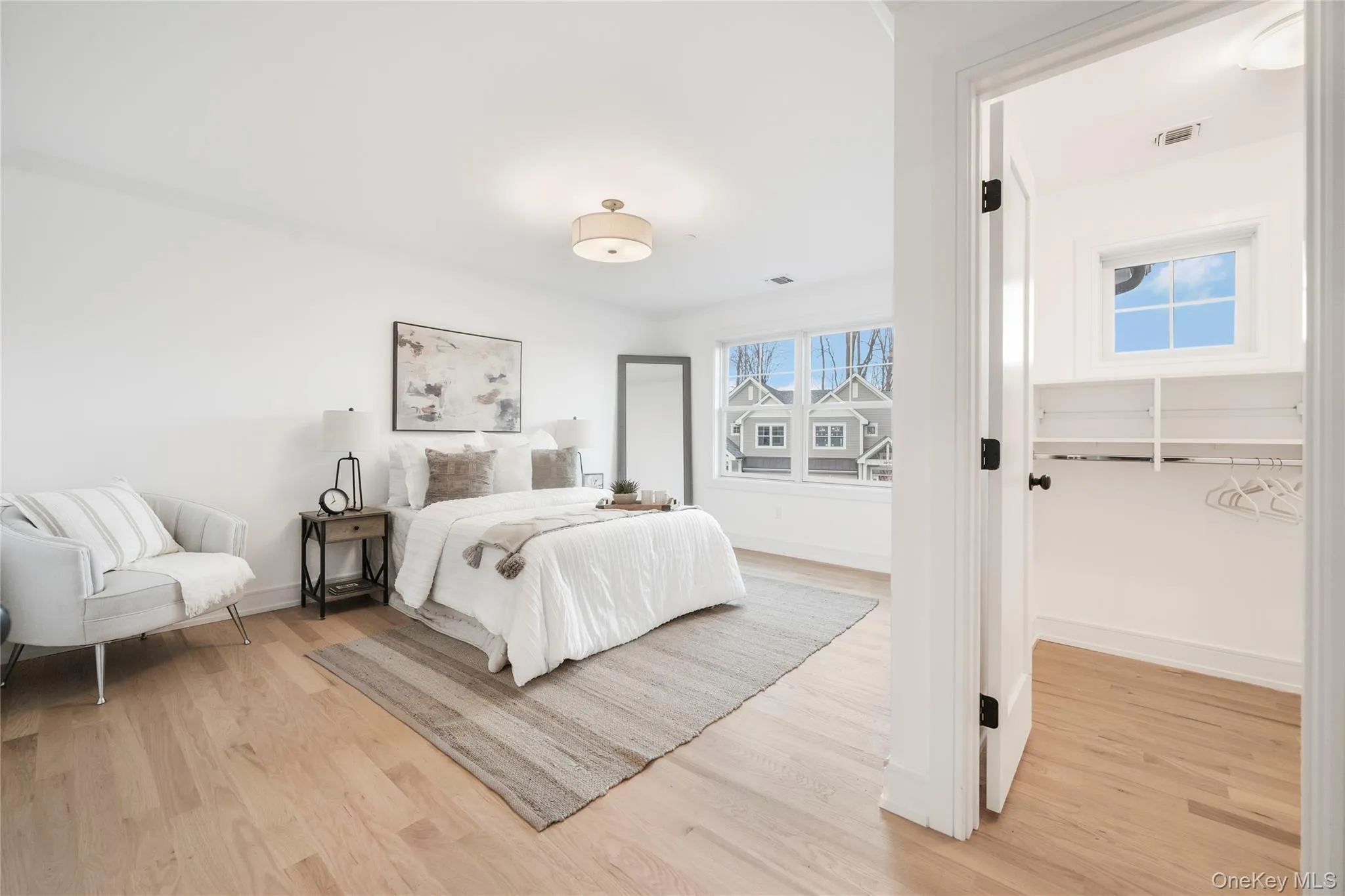 Bedroom featuring light hardwood / wood-style flooring Bedroom featuring light hardwood / wood-style flooring