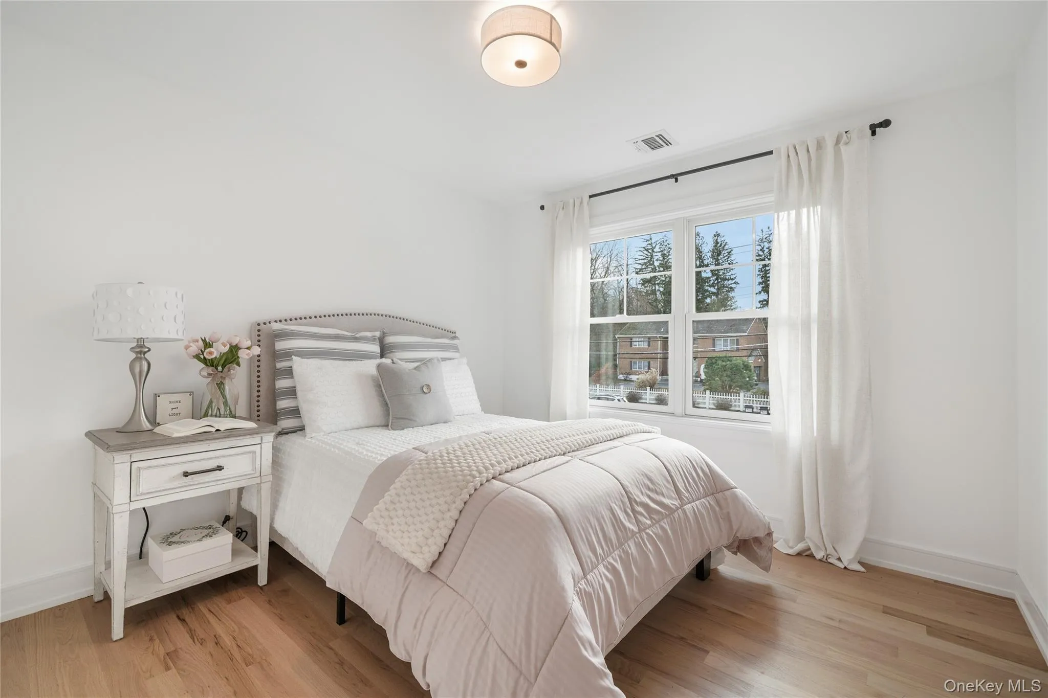 Bedroom with light hardwood / wood-style floors Bedroom with light hardwood / wood-style floors