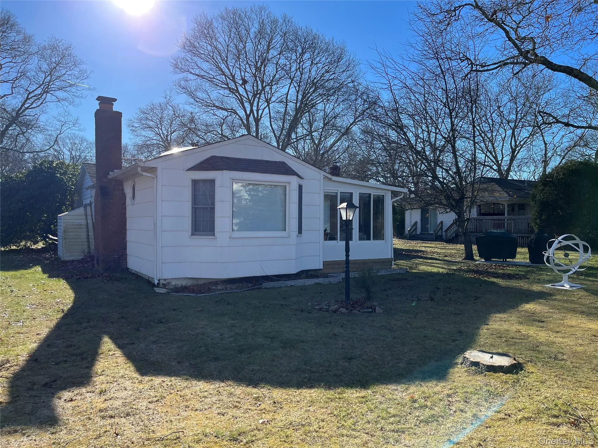 Back of the house. Living room and Sunroom Back of the house. Living room and Sunroom