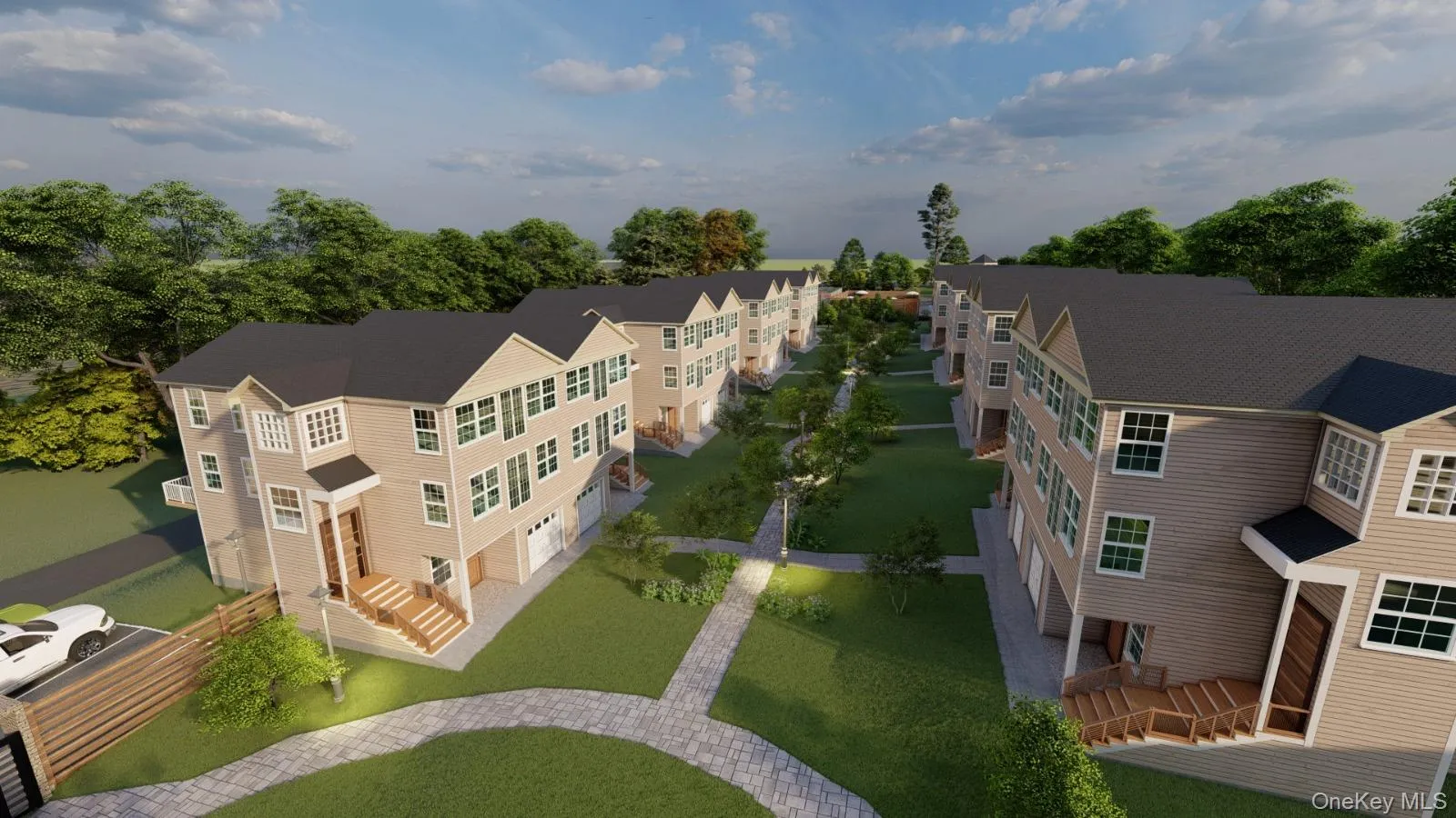 Contemporary townhome community featuring multiple buildings with tan siding and dark roofs Contemporary townhome community featuring multiple buildings with tan siding and dark roofs