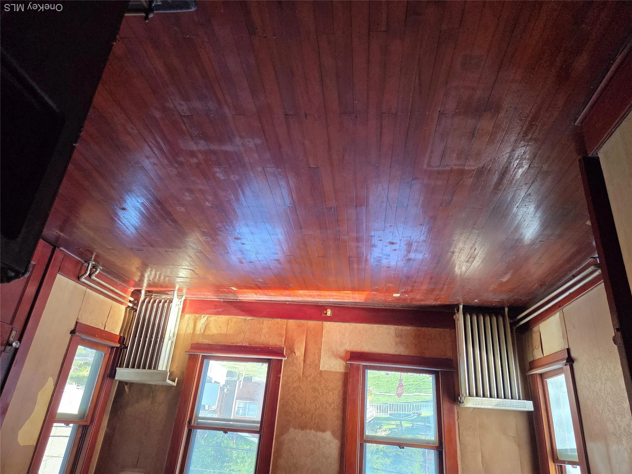 Second floor bedroom facing the front of the building with hardwood floors. Second floor bedroom facing the front of the building with hardwood floors.
