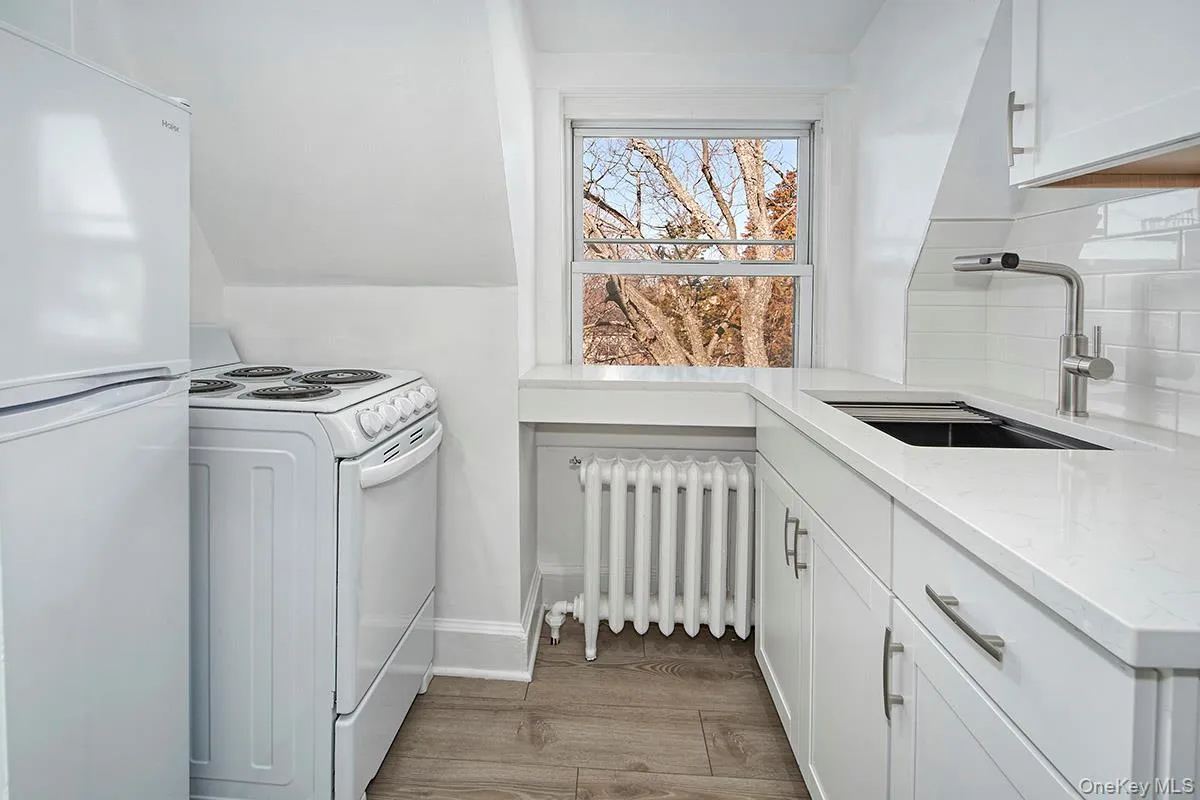 All new kitchen with subway tile backsplash, stainless sink and sleek faucet, electric range and fridge All new kitchen with subway tile backsplash, stainless sink and sleek faucet, electric range and fridge