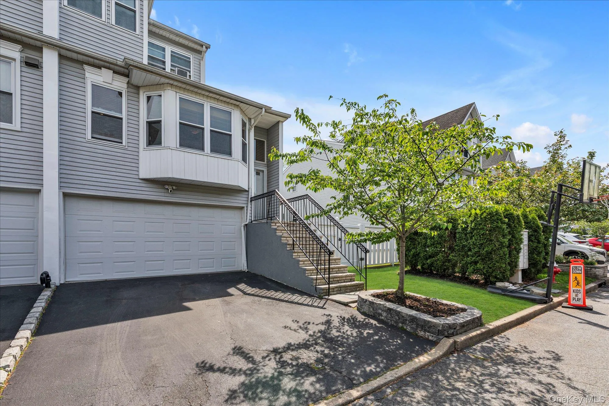 Two car garage with additional driveway parking. Two car garage with additional driveway parking.