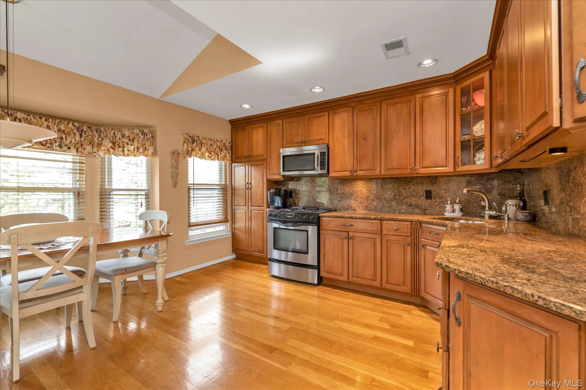 Beautiful front facing view of eat-in kitchen with large windows and excellent source of natural light Beautiful front facing view of eat-in kitchen with large windows and excellent source of natural light