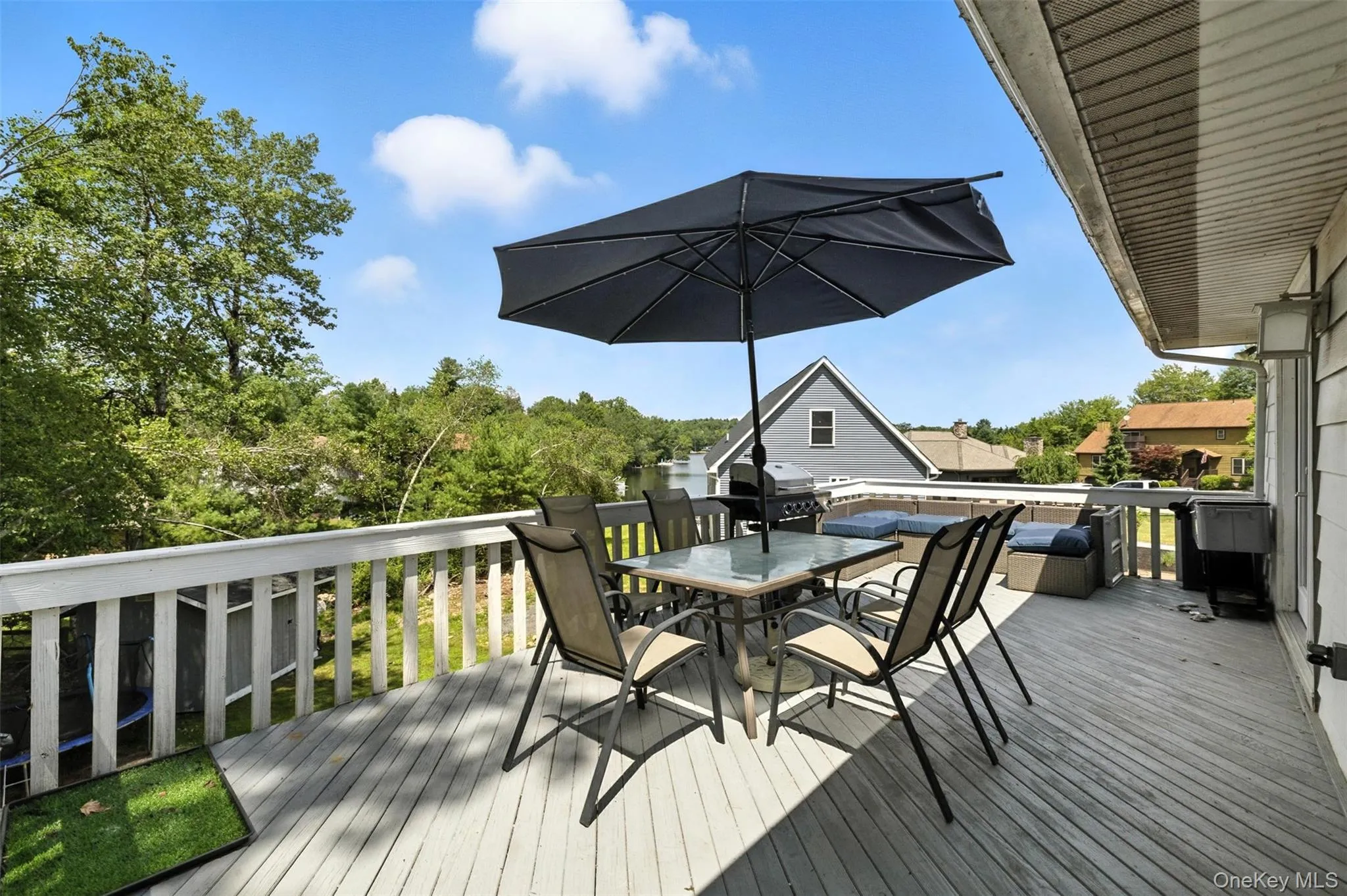 Deck featuring outdoor dining area and grilling area Deck featuring outdoor dining area and grilling area