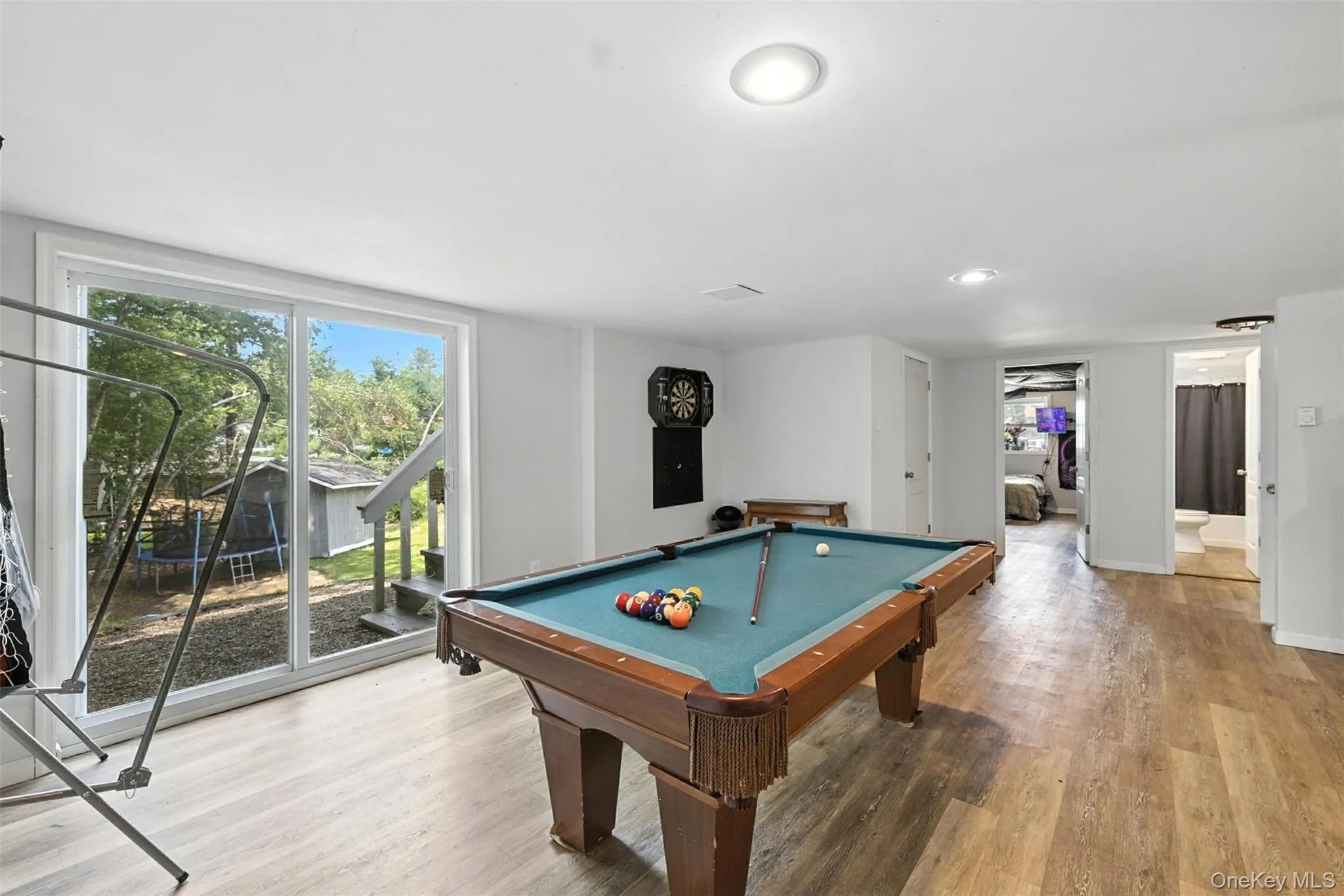 Rec room featuring light wood-style flooring, billiards table, and recessed lighting Rec room featuring light wood-style flooring, billiards table, and recessed lighting