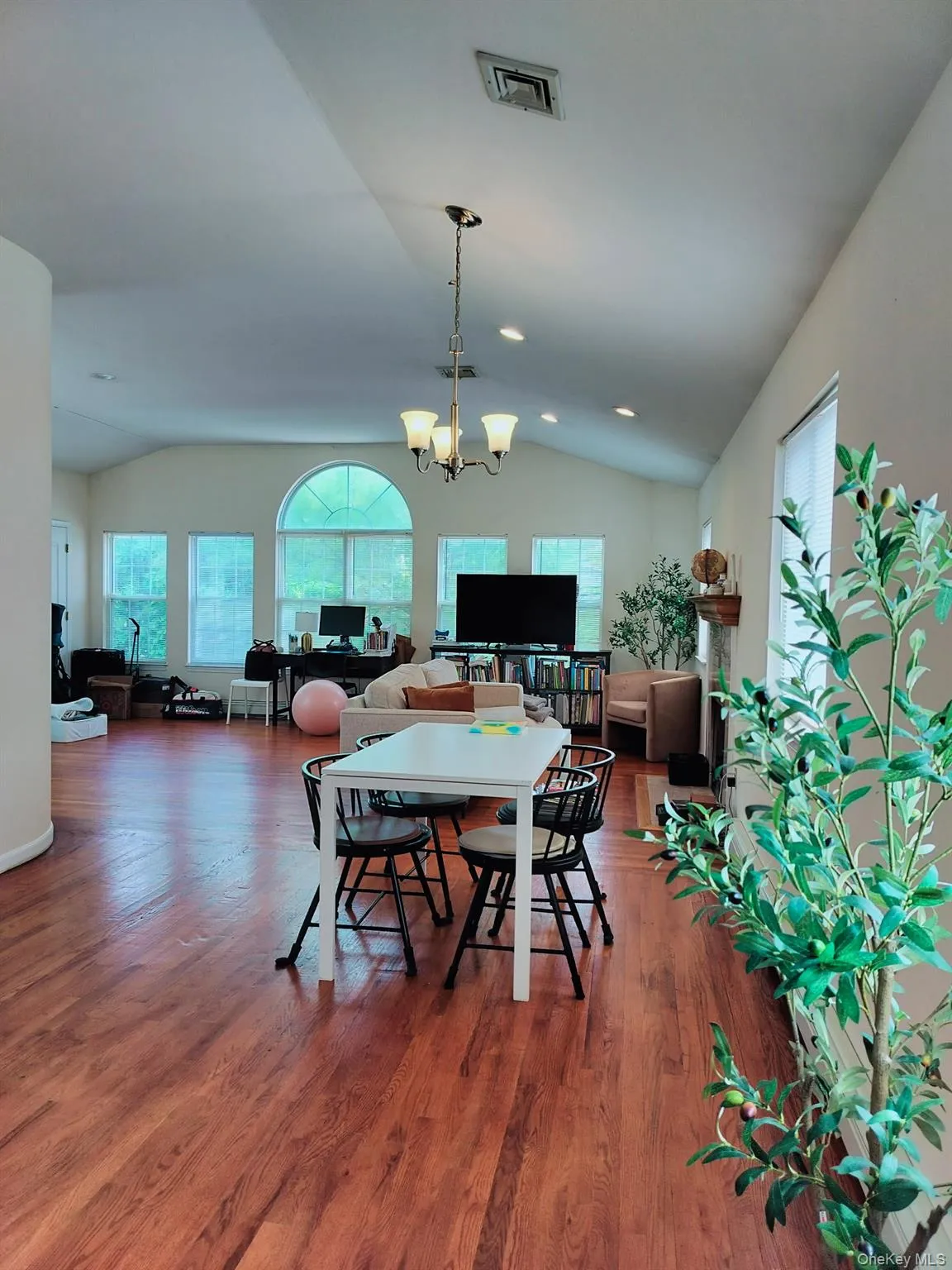 Dining area and oversized living room with wood burning fire place Dining area and oversized living room with wood burning fire place