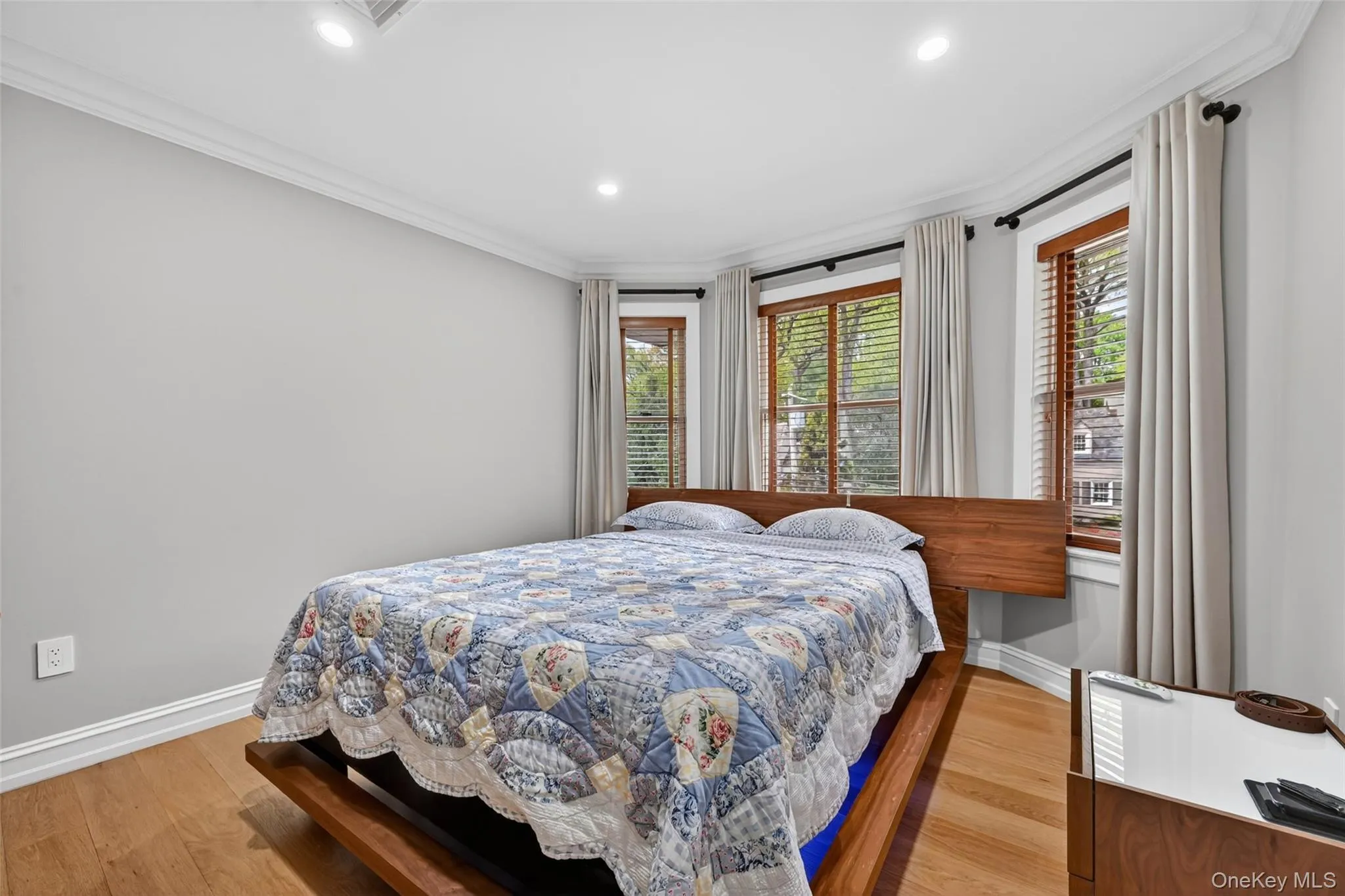 Room with light-toned walls and wood-finish flooring Room with light-toned walls and wood-finish flooring