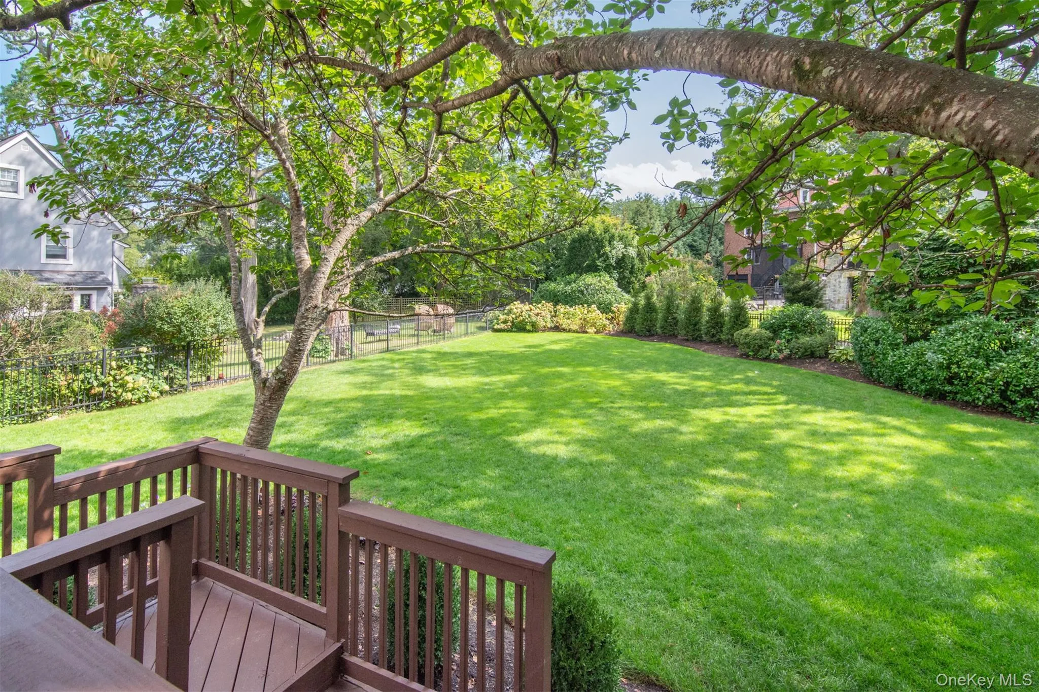 Fenced backyard featuring a deck Fenced backyard featuring a deck