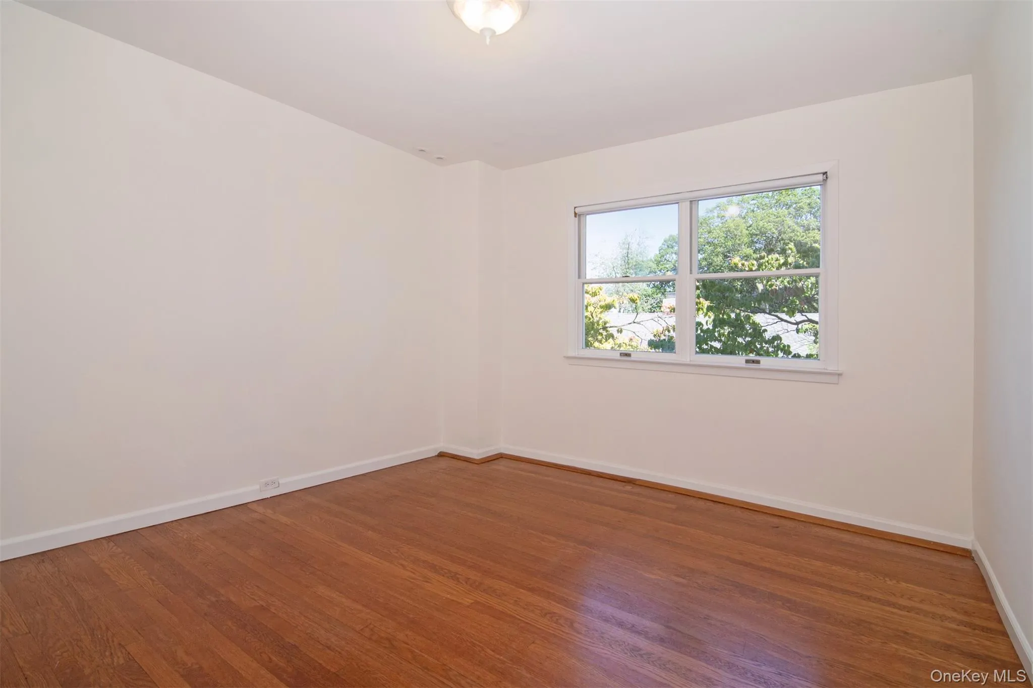 Empty room with wood finished floors Empty room with wood finished floors