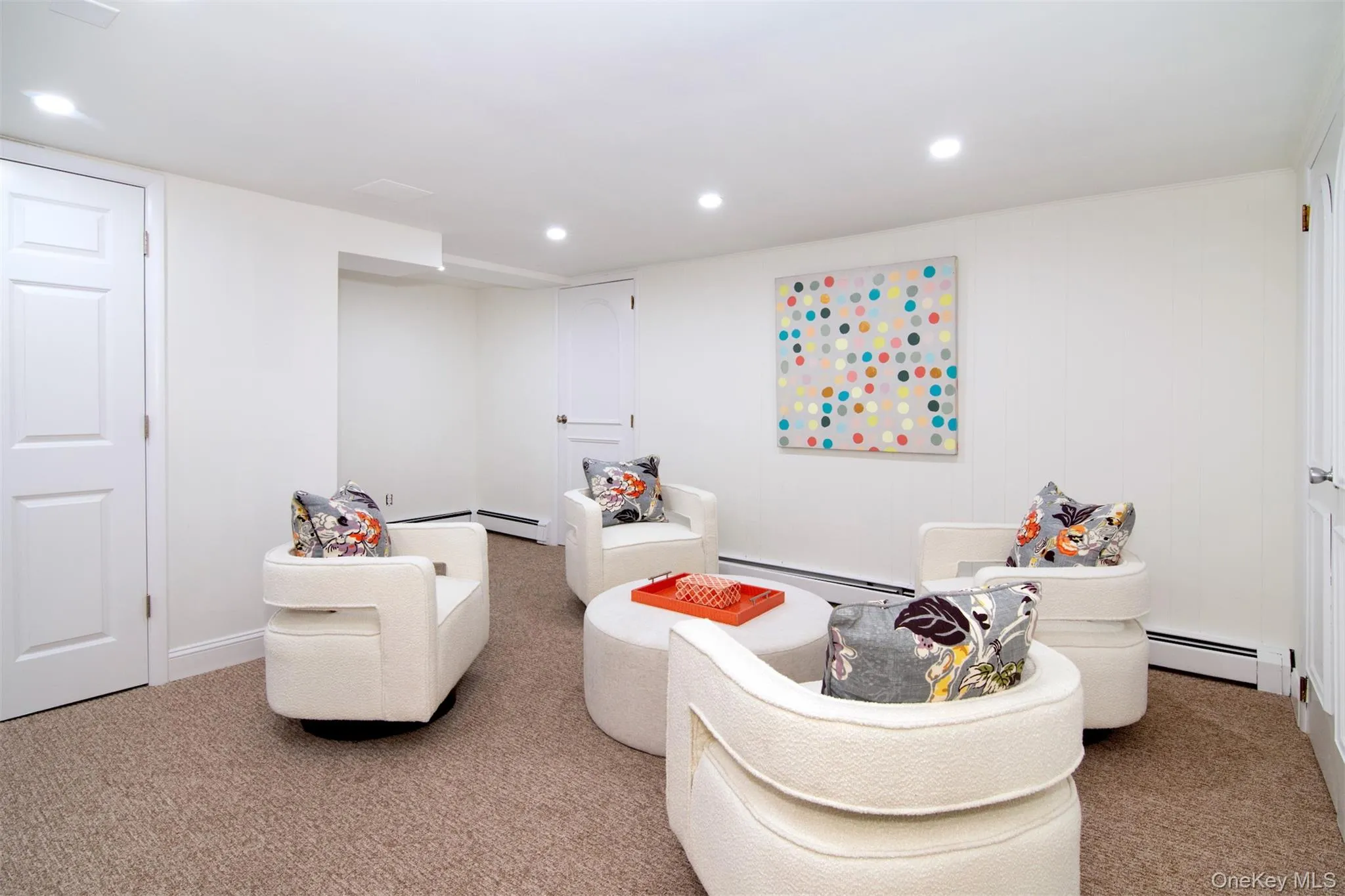 Bedroom featuring carpet floors, recessed lighting, and a baseboard heating unit Bedroom featuring carpet floors, recessed lighting, and a baseboard heating unit