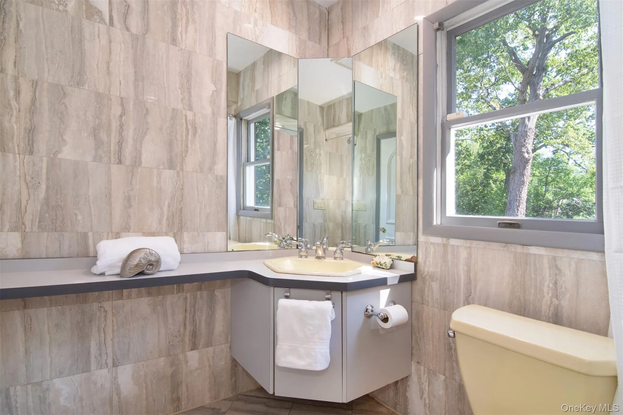 Full bath with tile walls and vanity Full bath with tile walls and vanity