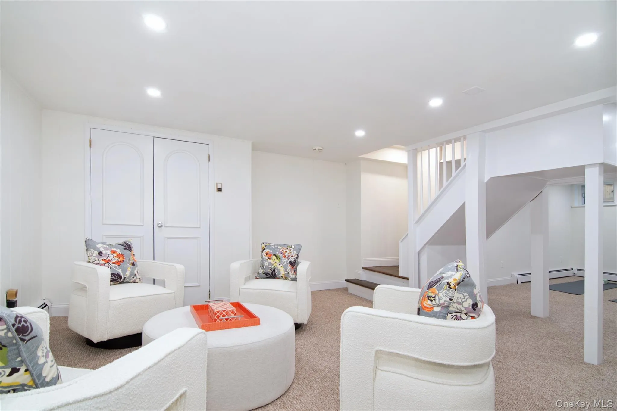 Carpeted living area with recessed lighting and stairway Carpeted living area with recessed lighting and stairway