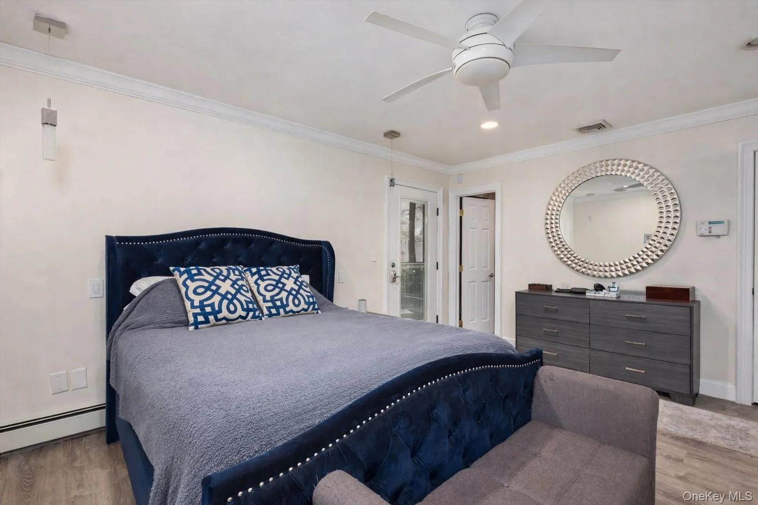 Bedroom featuring light wood-style floors, crown molding, ceiling fan, and recessed lighting Bedroom featuring light wood-style floors, crown molding, ceiling fan, and recessed lighting