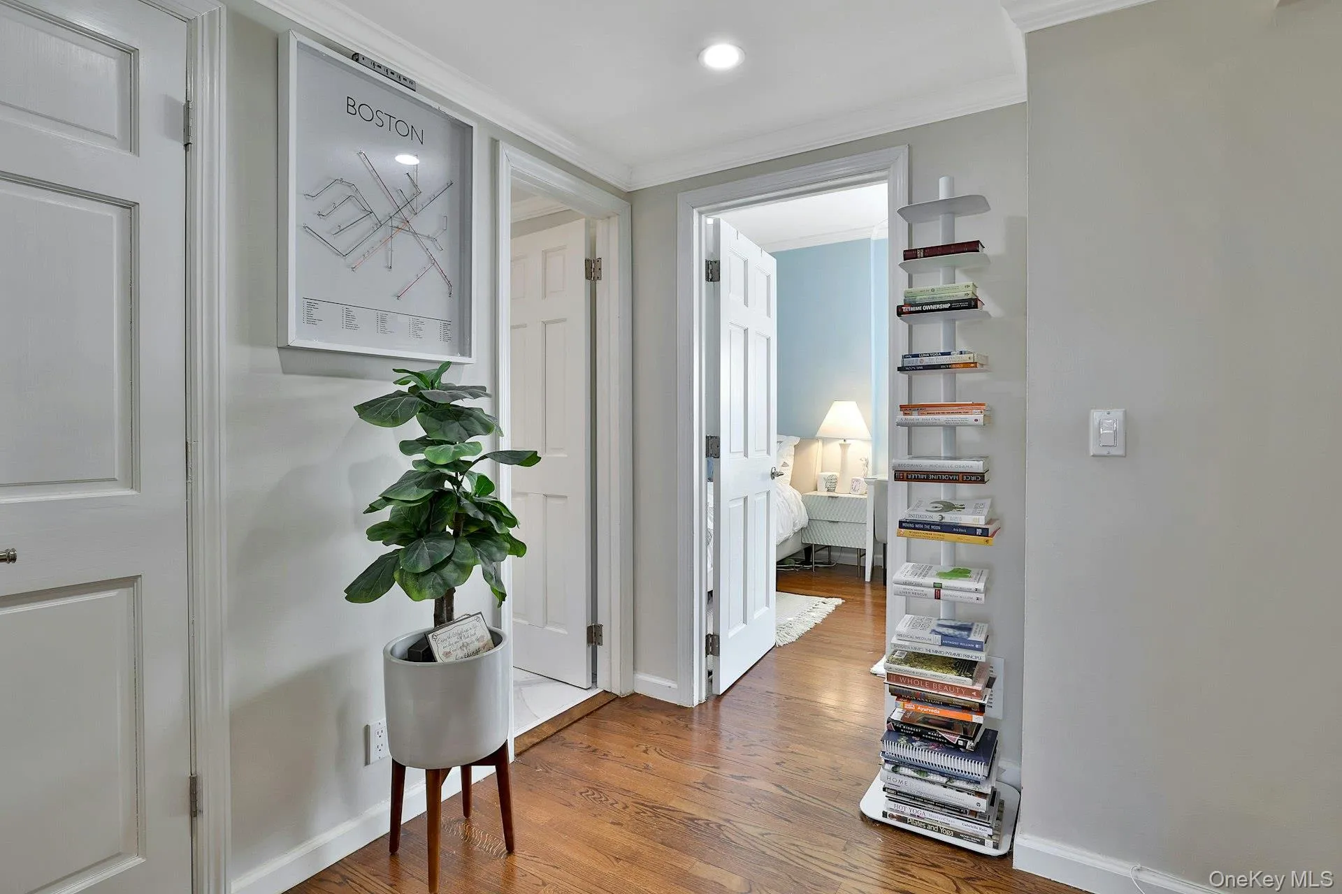 2nd floor hallway featuring crown molding and wood-type flooring 2nd floor hallway featuring crown molding and wood-type flooring
