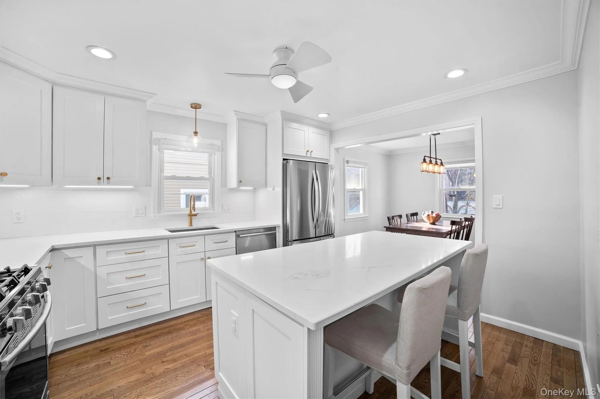 Completely renovated kitchen with new appliances and golden brass fixtures Completely renovated kitchen with new appliances and golden brass fixtures