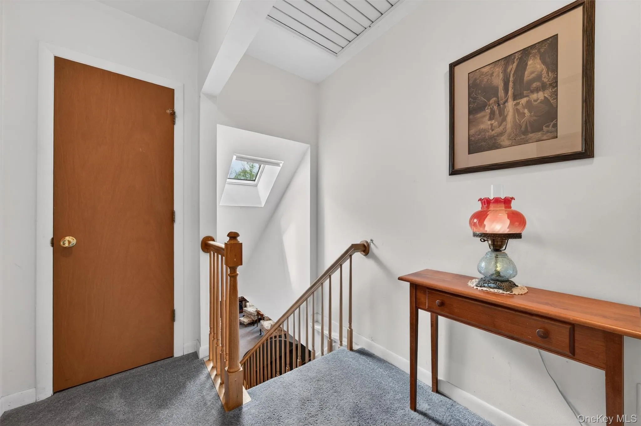 Upstairs landing features a Skylight Upstairs landing features a Skylight