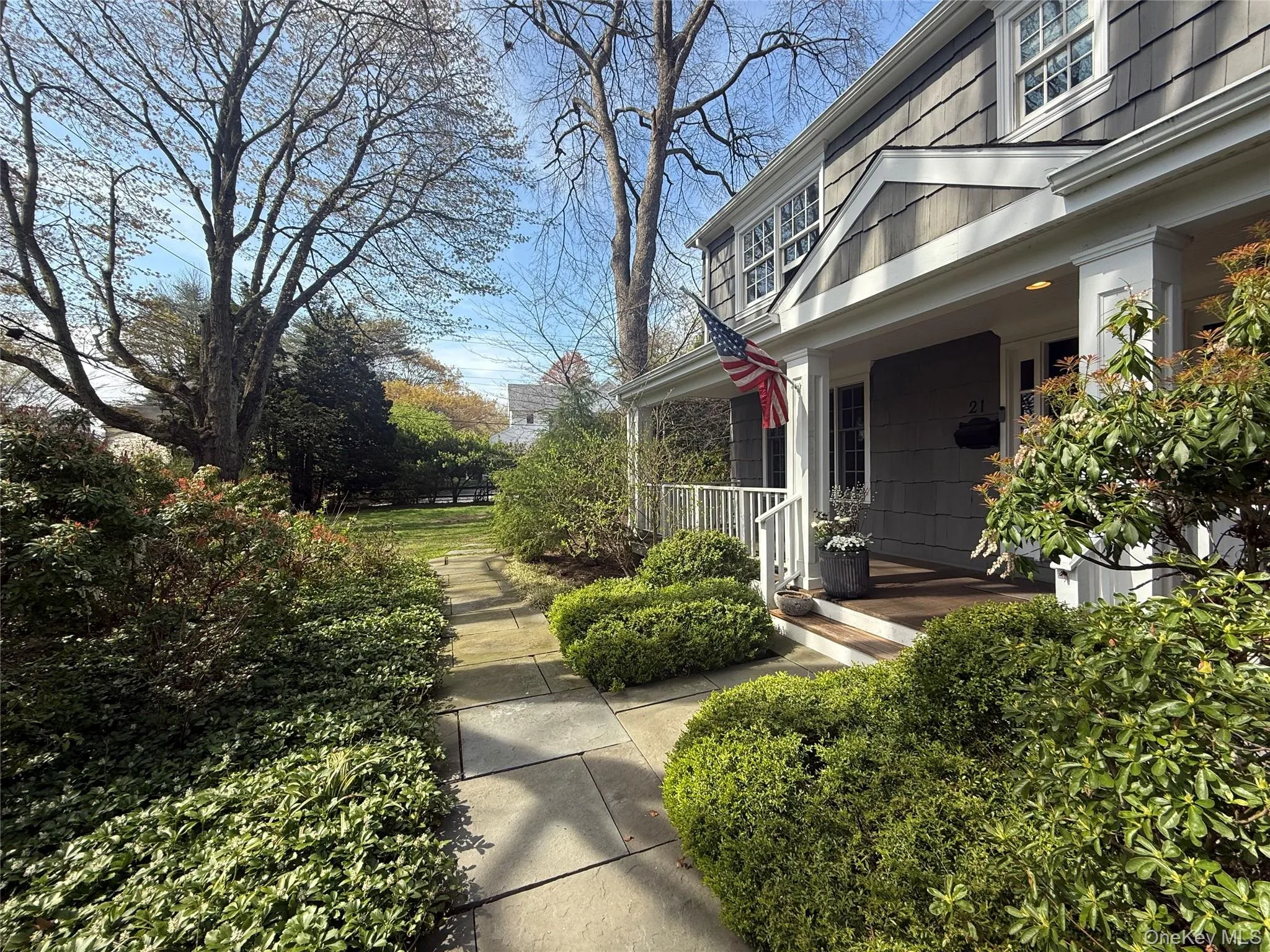 View of property exterior featuring a porch View of property exterior featuring a porch