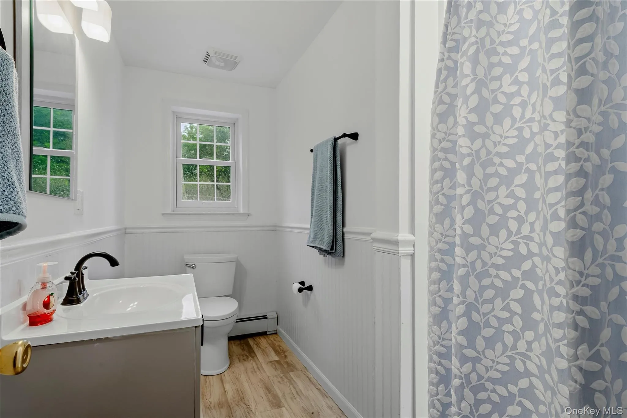 This bathroom on the lower level has a walk in shower, new floor,vanity & sink. Your overnight guests will appreciate! This bathroom on the lower level has a walk in shower, new floor,vanity & sink. Your overnight guests will appreciate!