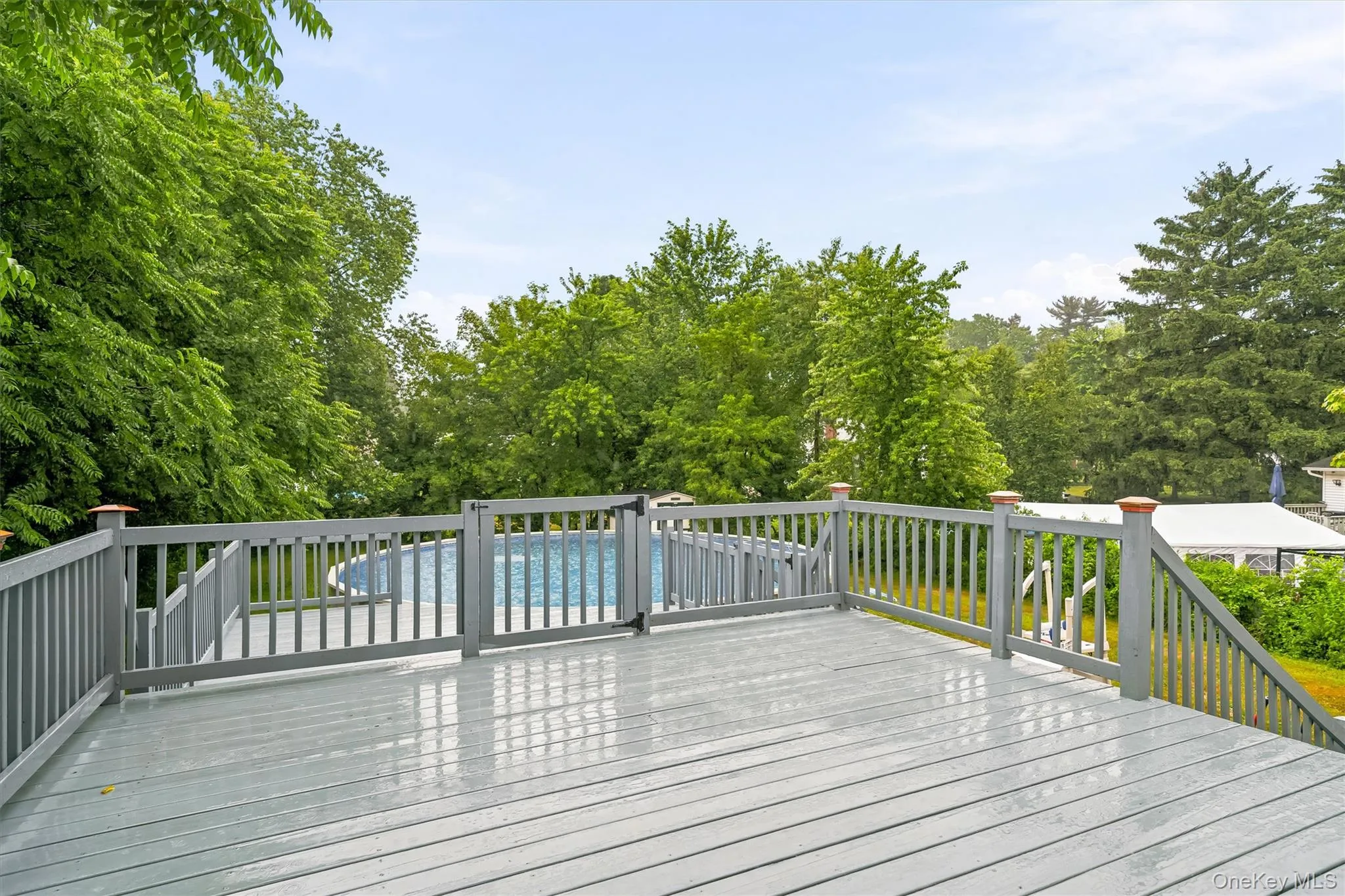 New 2 tier deck overlooking the above ground pool. New 2 tier deck overlooking the above ground pool.