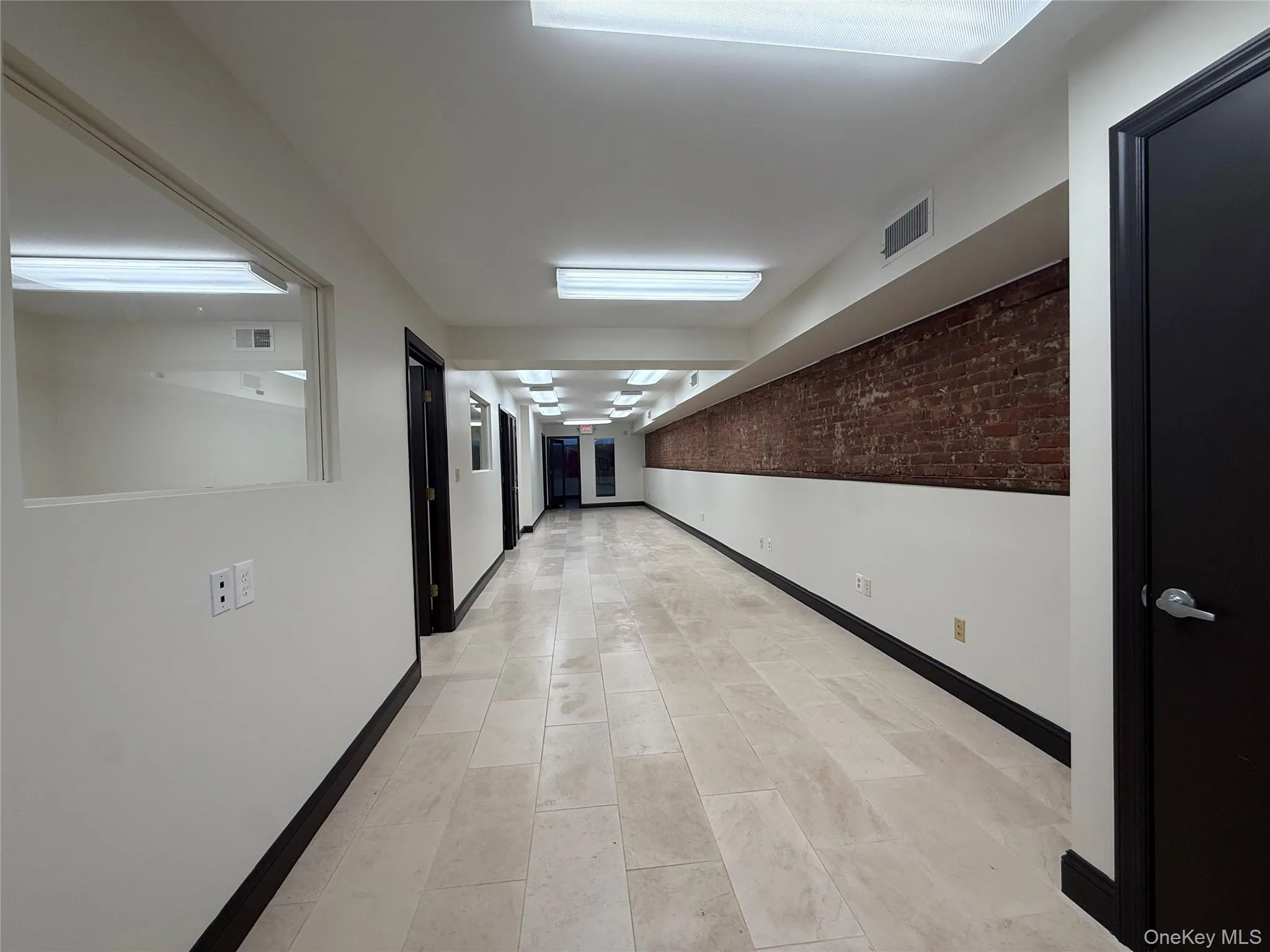 Open Area with three separate offices on the left side and end of space Open Area with three separate offices on the left side and end of space
