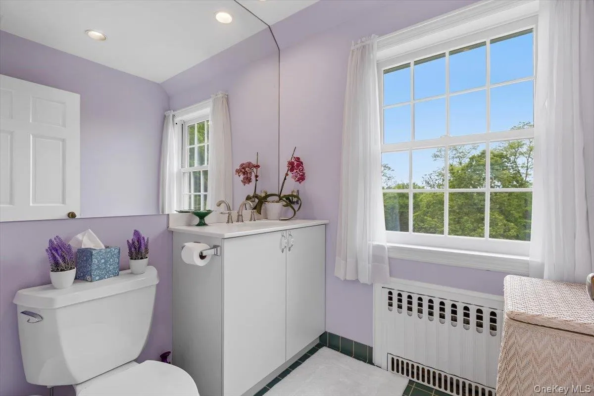 In addition to the full Bathroom in the bedroom wing, there is this updated half bathroom upstairs. In addition to the full Bathroom in the bedroom wing, there is this updated half bathroom upstairs.