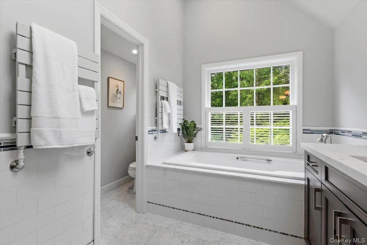 Luxuriate in the soaking tub, followed by heated towels. There’s also a separate toilet closet in the Primary Bathroom. Luxuriate in the soaking tub, followed by heated towels. There’s also a separate toilet closet in the Primary Bathroom.