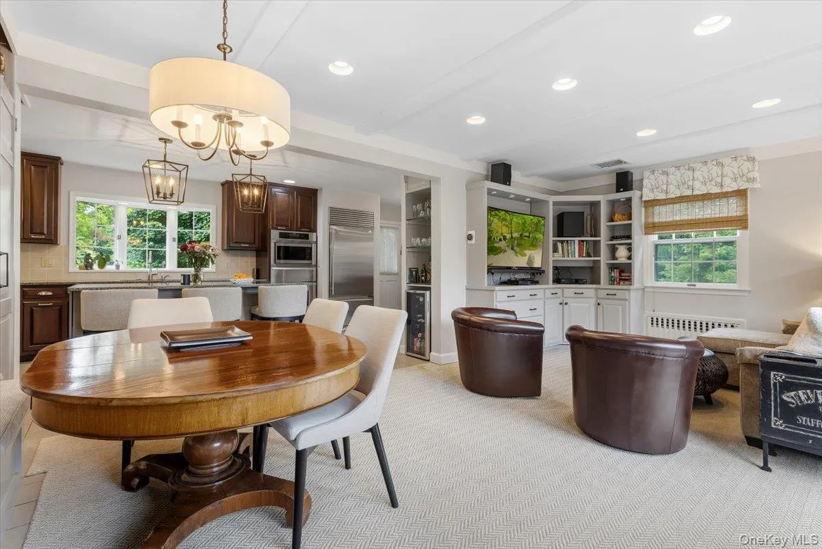 The Breakfast area is open to the Family Room with custom built-in entertainment and storage units. The Breakfast area is open to the Family Room with custom built-in entertainment and storage units.