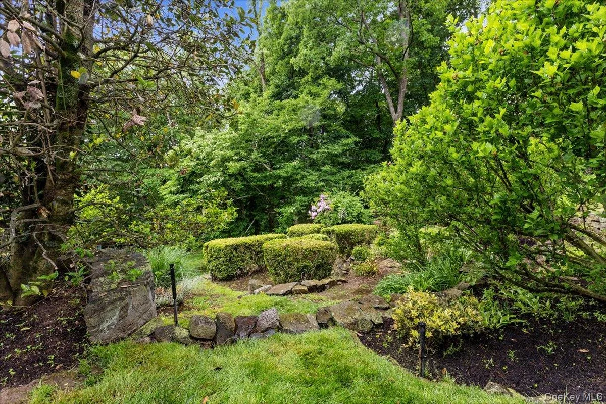 This lovely garden area is professionally landscaped off the rear patio. This lovely garden area is professionally landscaped off the rear patio.