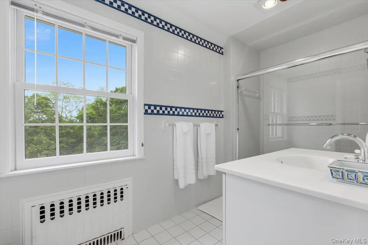 Updated full Bathroom on the bedroom wing with combined bathtub/shower. Updated full Bathroom on the bedroom wing with combined bathtub/shower.
