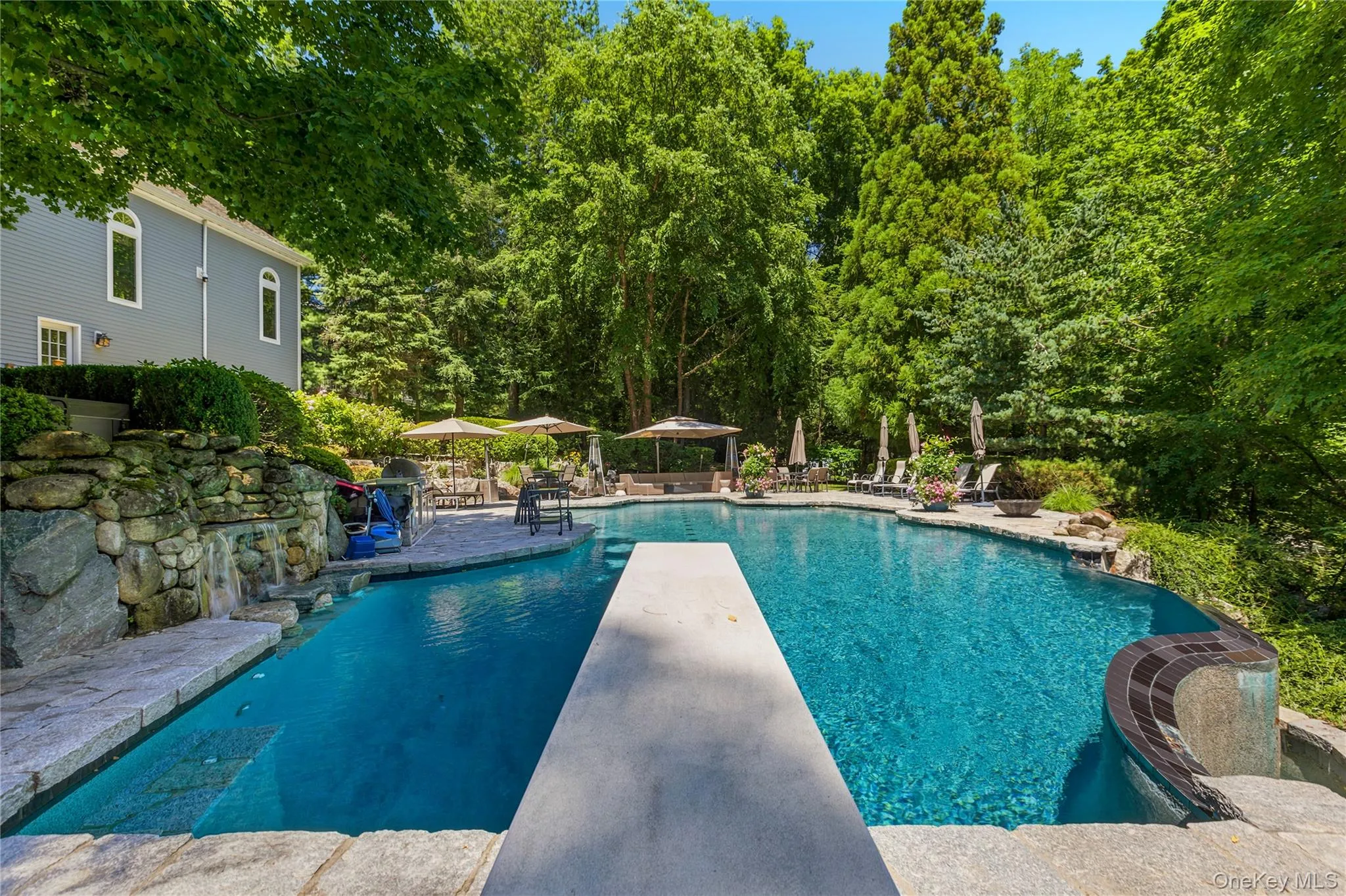 View from diving board of pool with infinity edge to the right View from diving board of pool with infinity edge to the right